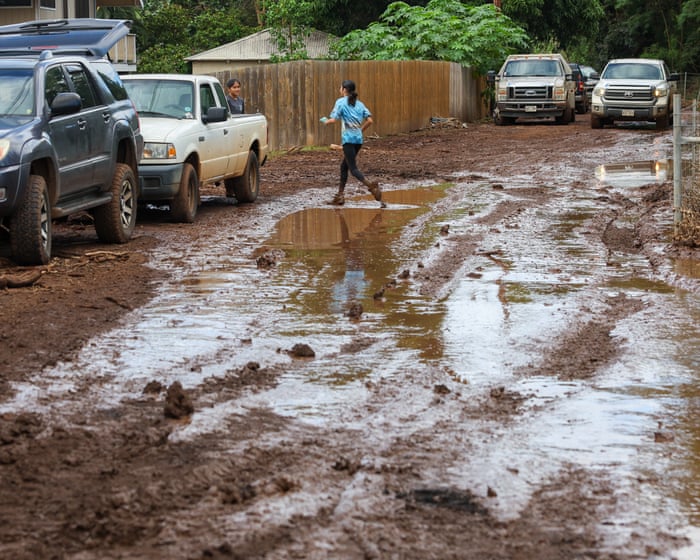 Red volcanic mud coats homes after Hawaii’s worst floods in 20 years