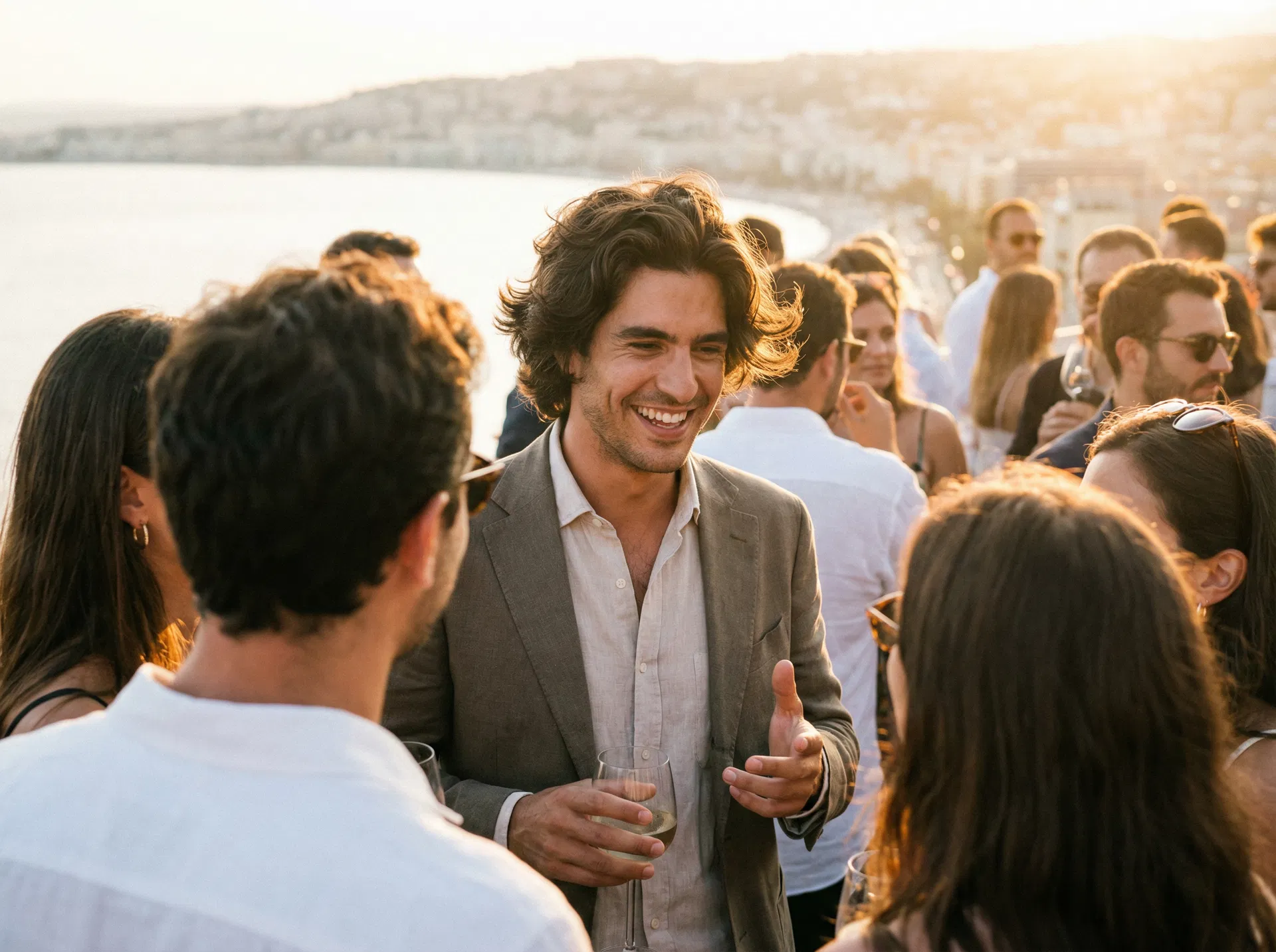 Confident well-groomed man with full thick natural hair 18 months after hair transplant enjoying social event with renewed confidence