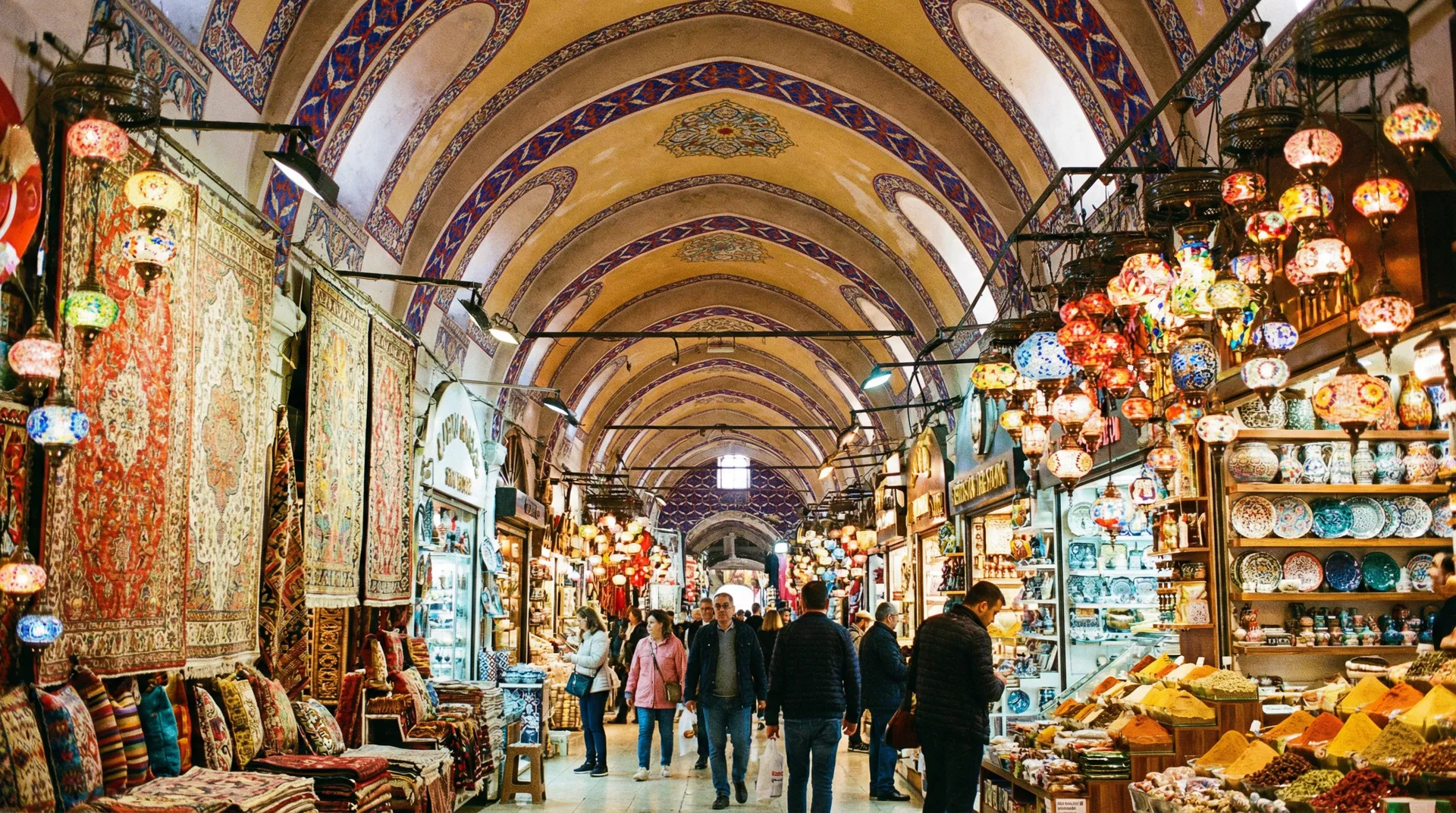 Inside the Grand Bazaar with colorful lanterns, carpets, and ceramics