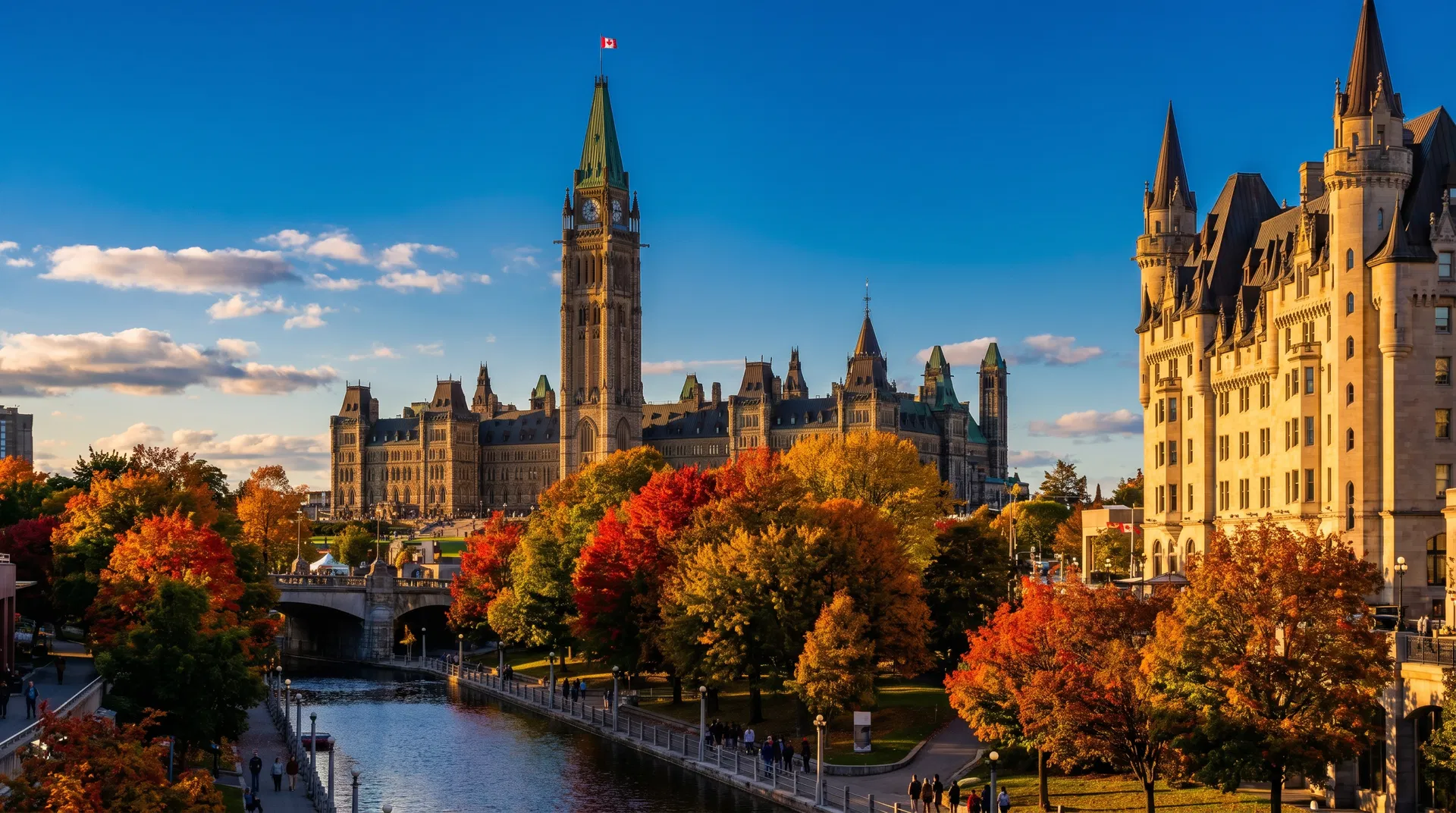 Ottawa Parliament Hill with Peace Tower against blue sky and autumn colours