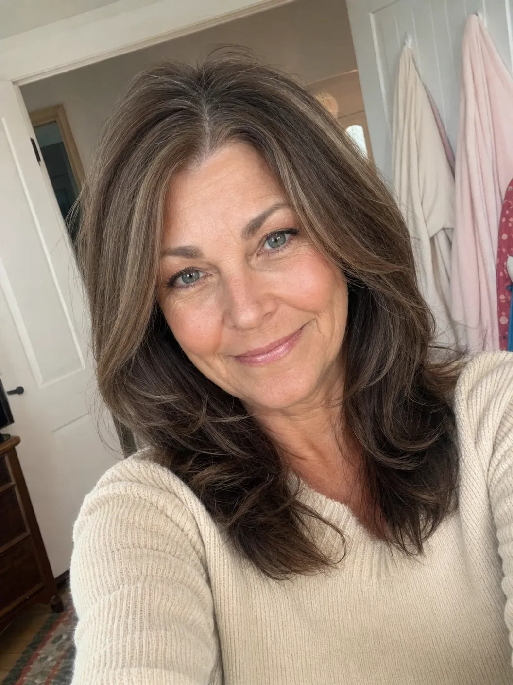 UGC style selfie of a confident woman over 30 with fuller-looking styled hair