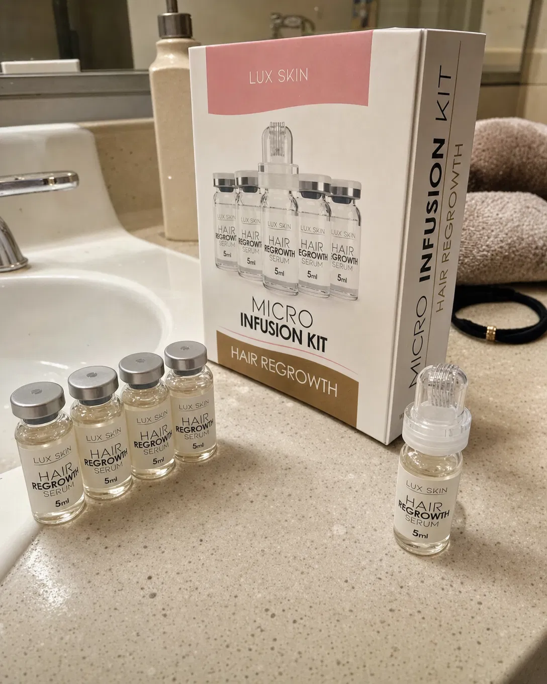 UGC style photo of Lux Skin Hair Growth micro-infusion kit packaging and serum vials on a bathroom sink