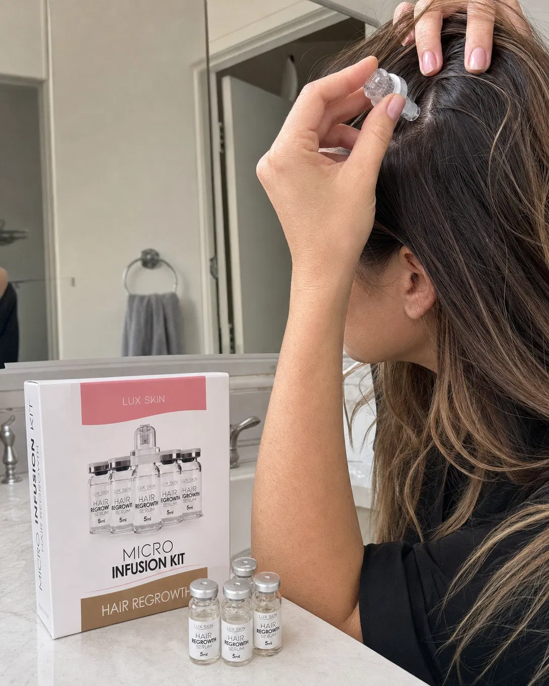 UGC style bathroom photo of woman over 30 applying micro-infusion scalp treatment