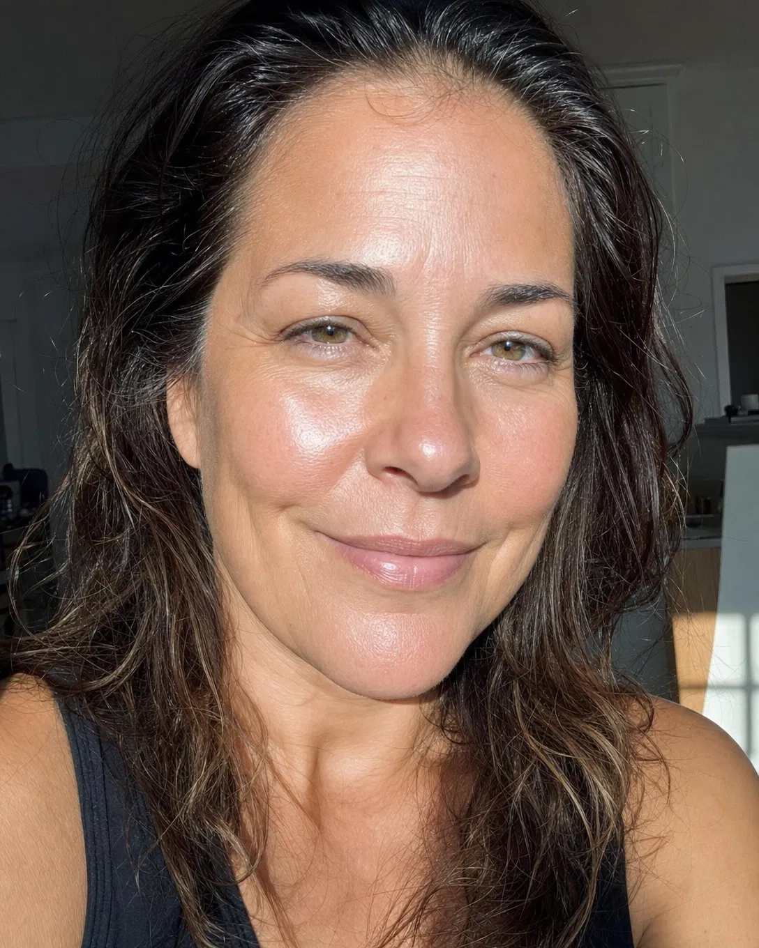 Woman with glowing calm skin after using Lux Skin Microbiome Restore