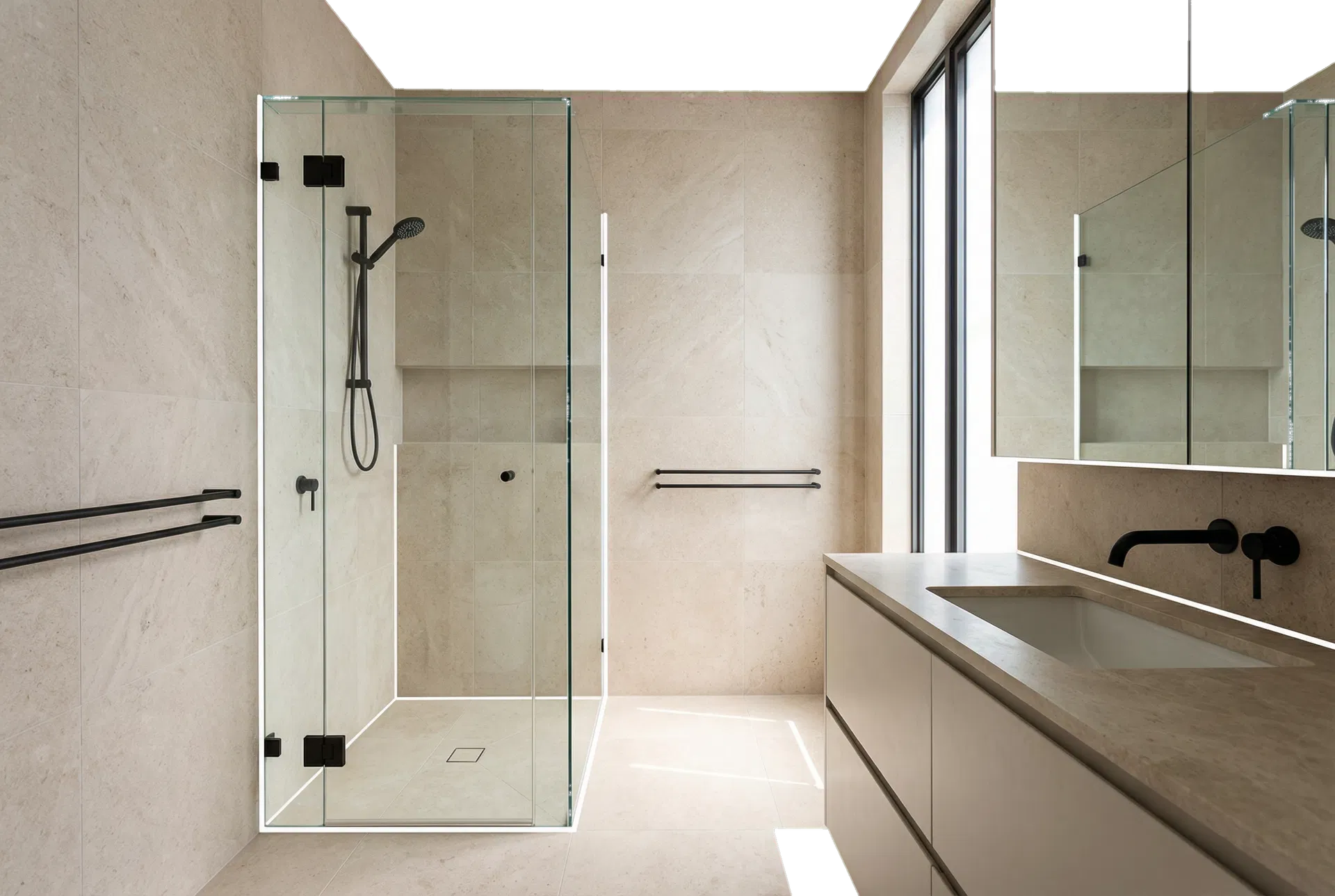 Minimal bathroom renovation showing clean silicone lines around a glass shower and vanity