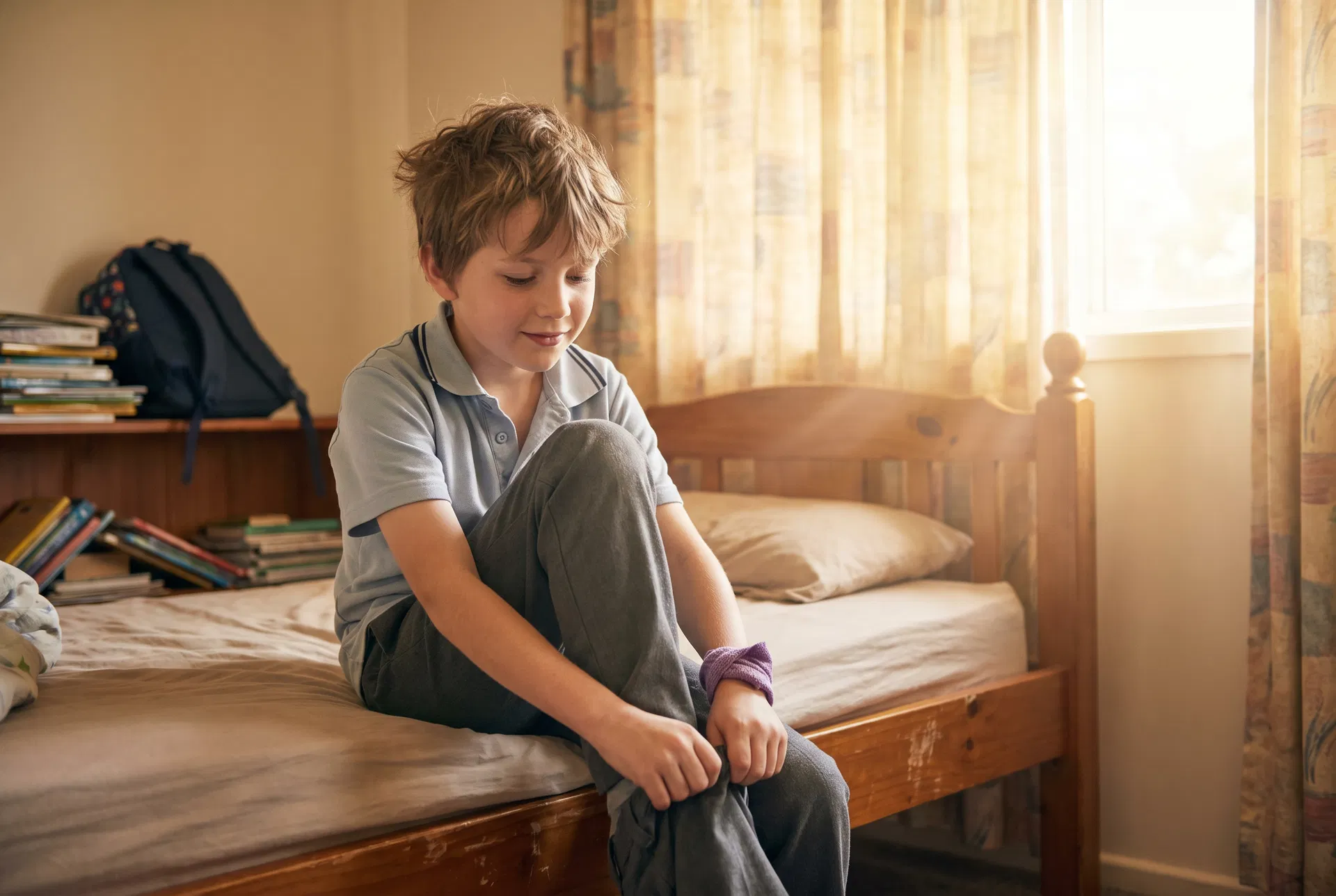Boy calmly getting ready for school independently