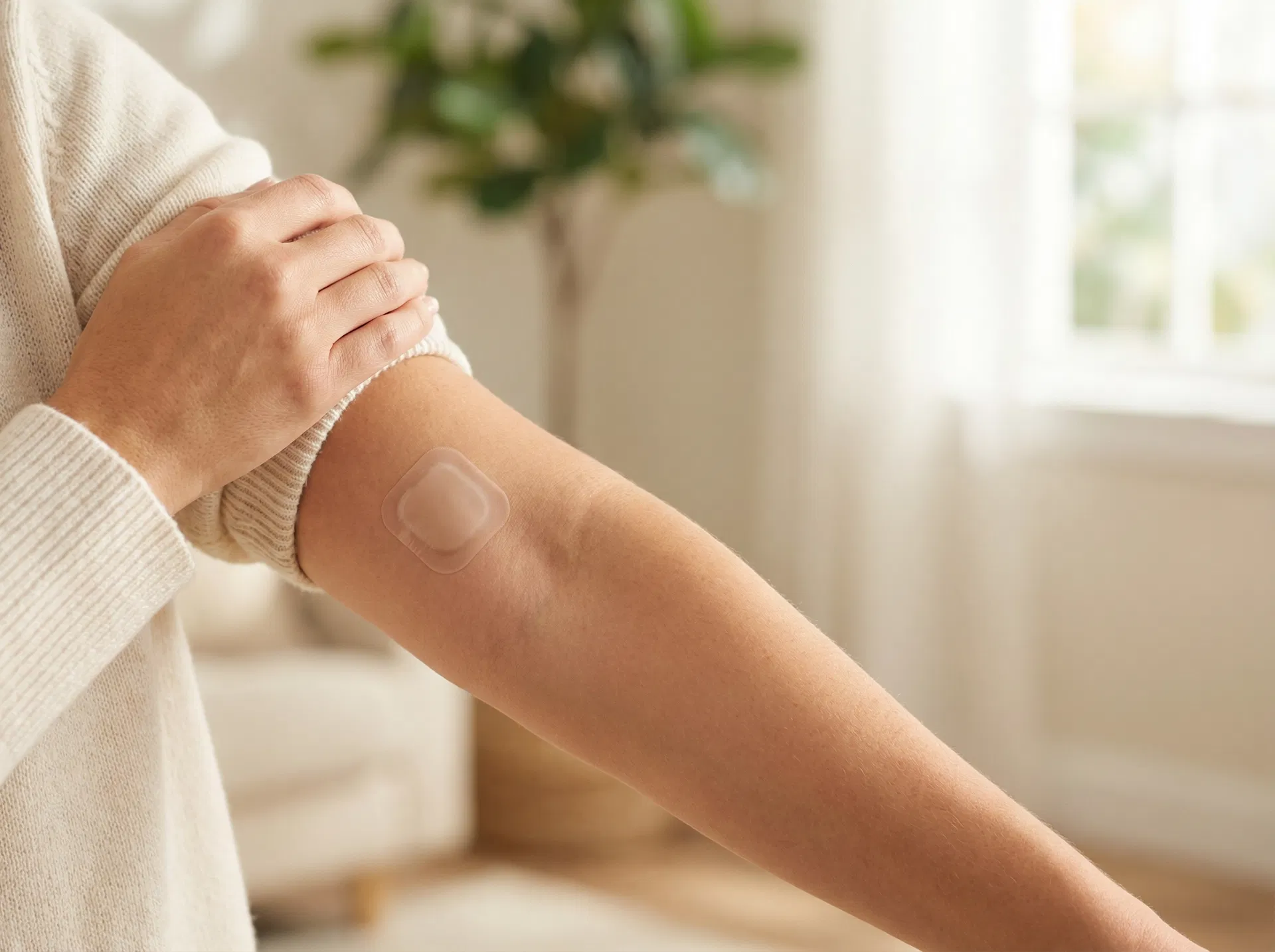 Discreet Glisera transdermal patch applied to upper arm