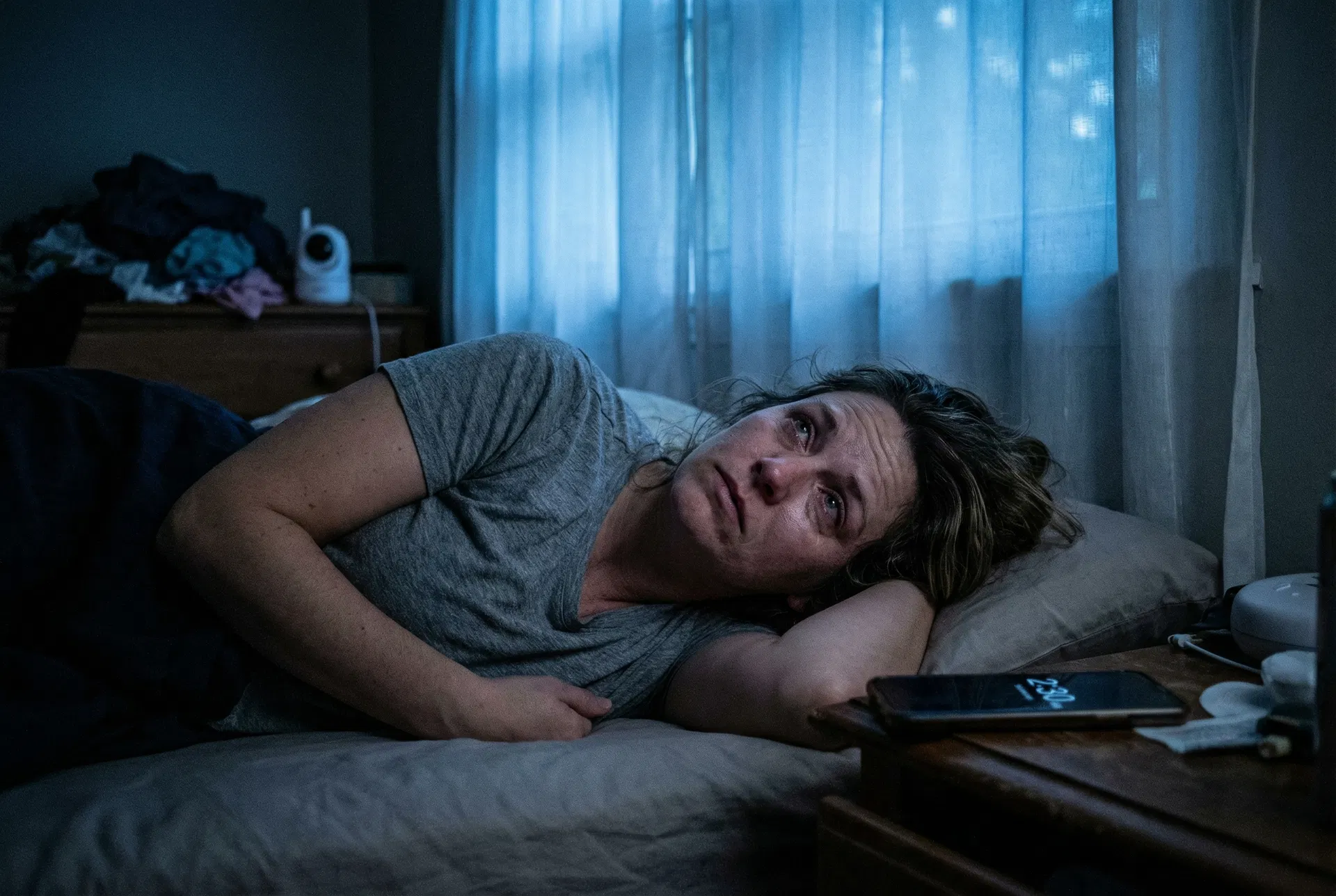 Mom lying awake at night, worried