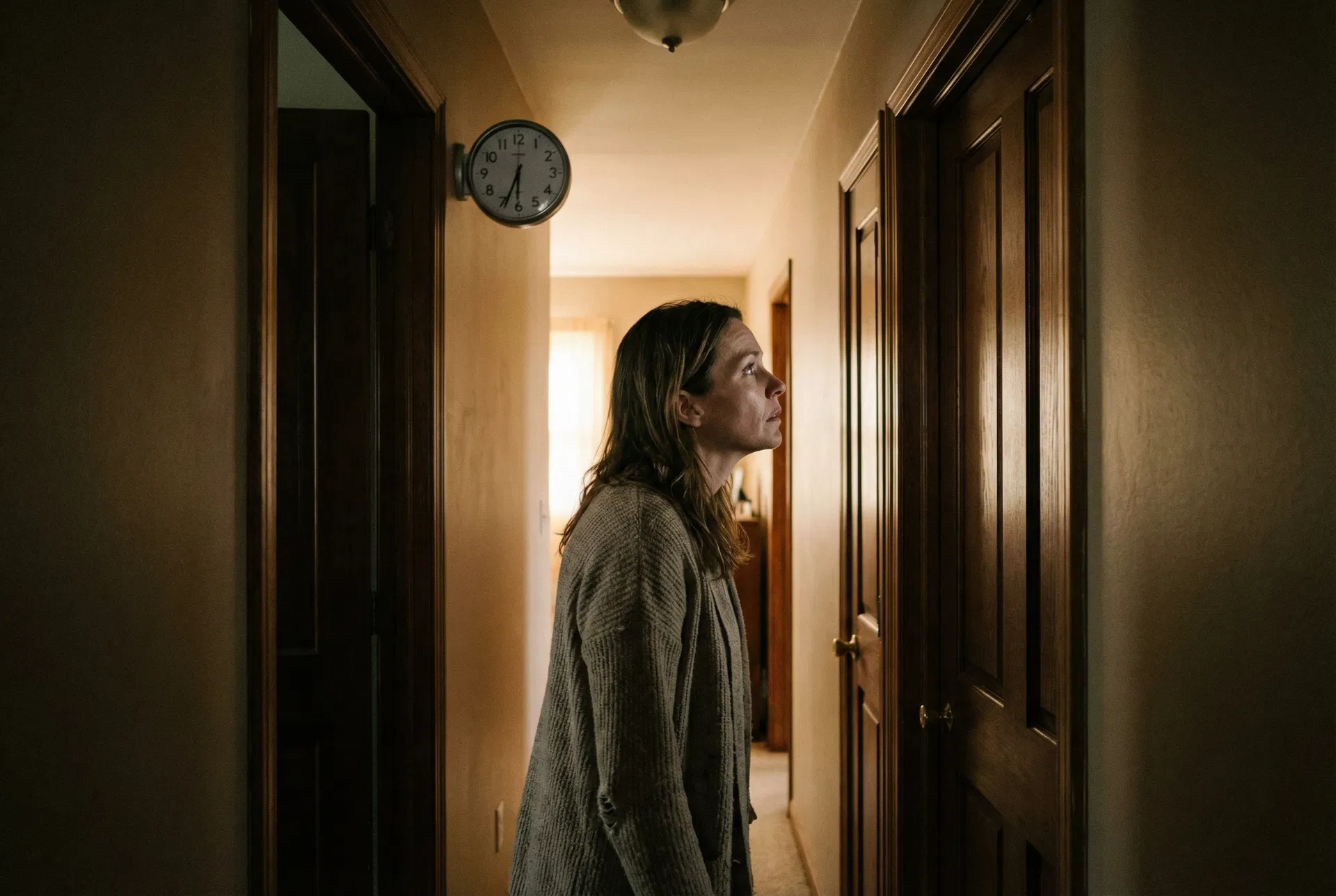 Mom turned toward her son in a parked car, son's face crumpled and crying, lavender wristband visible on his wrist