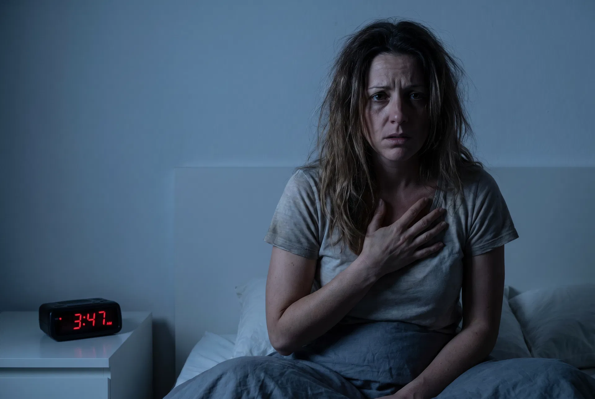 Woman waking up anxious at 3:47 AM