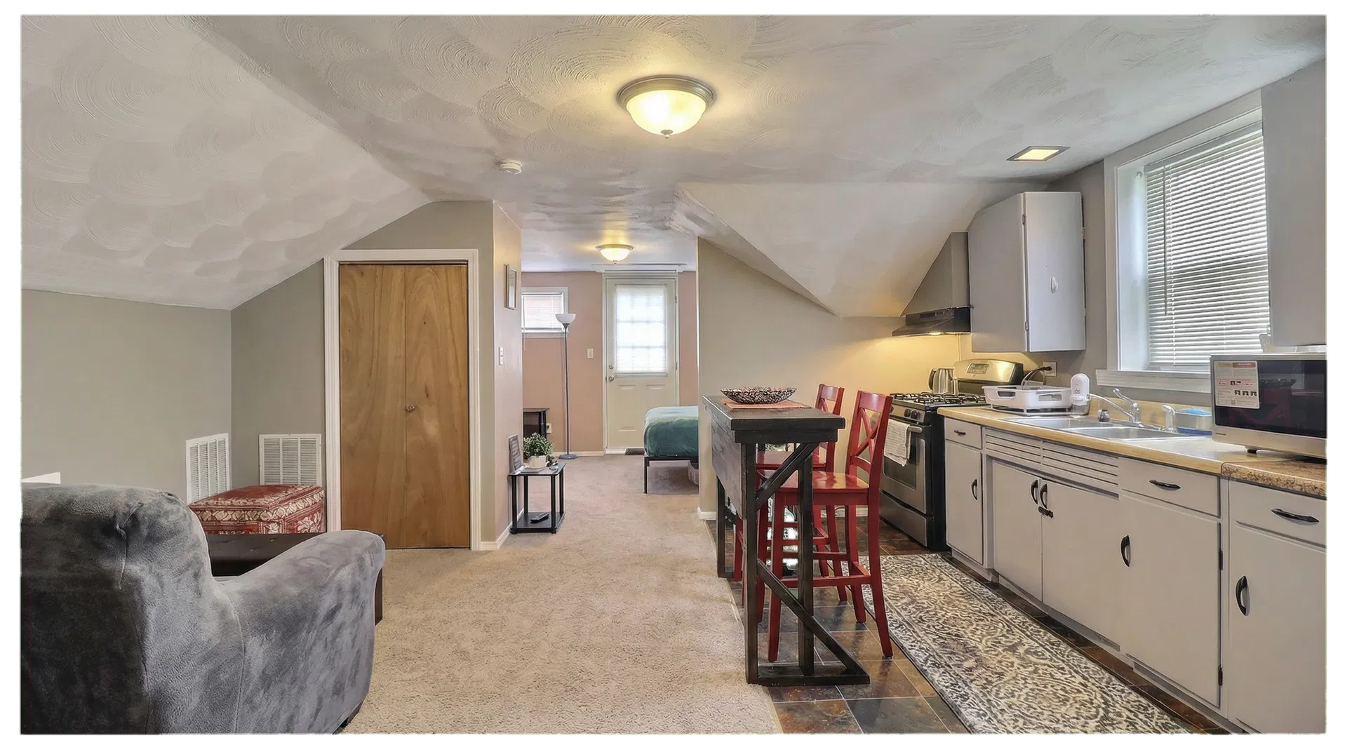 The detached garage and upstairs apartment make the investment case legible.