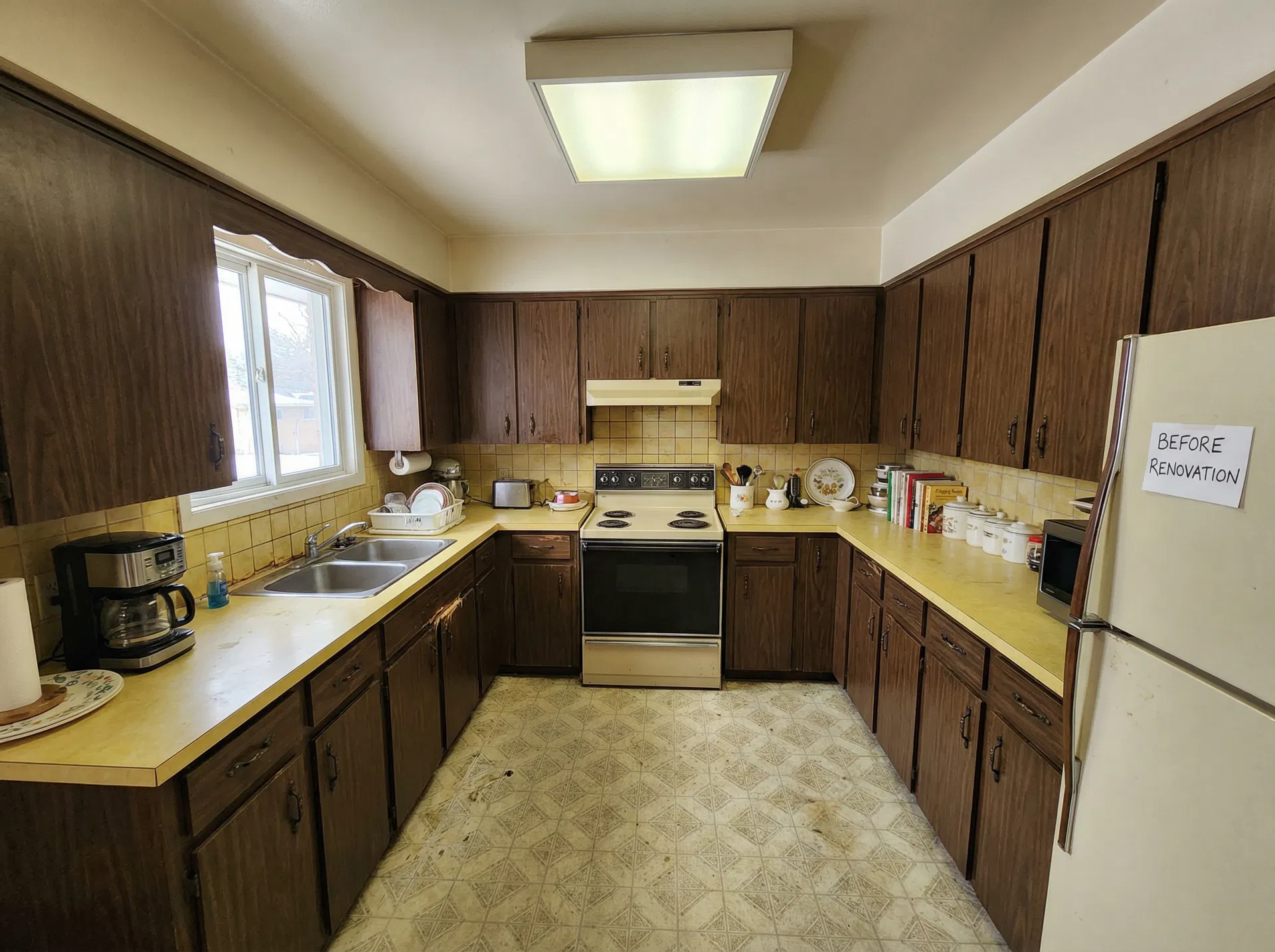 Kitchen — painted cabinets, new counters, subway tile backsplash, LVP floors — Before