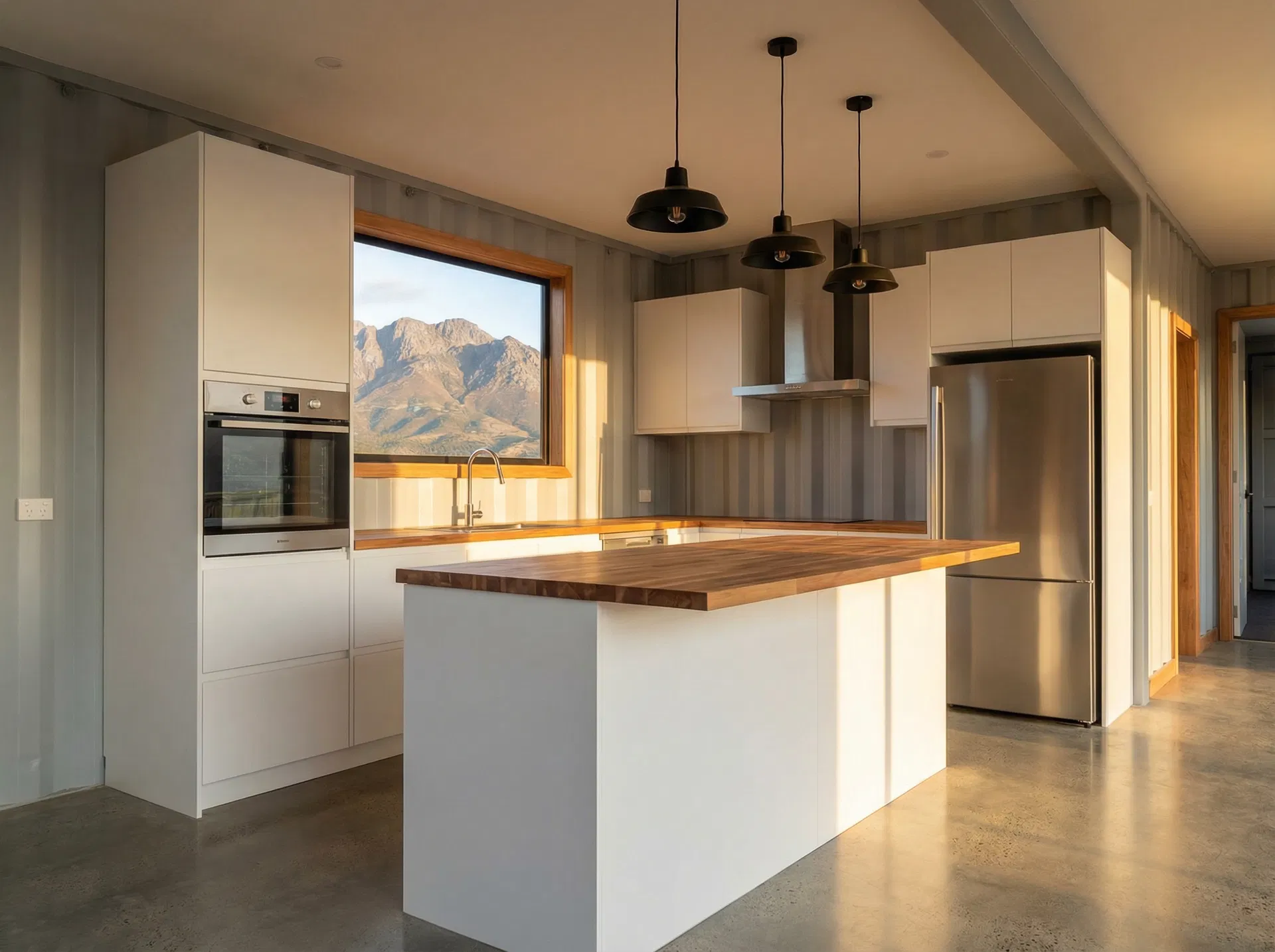 Modern kitchen with butcher block countertop and mountain view window