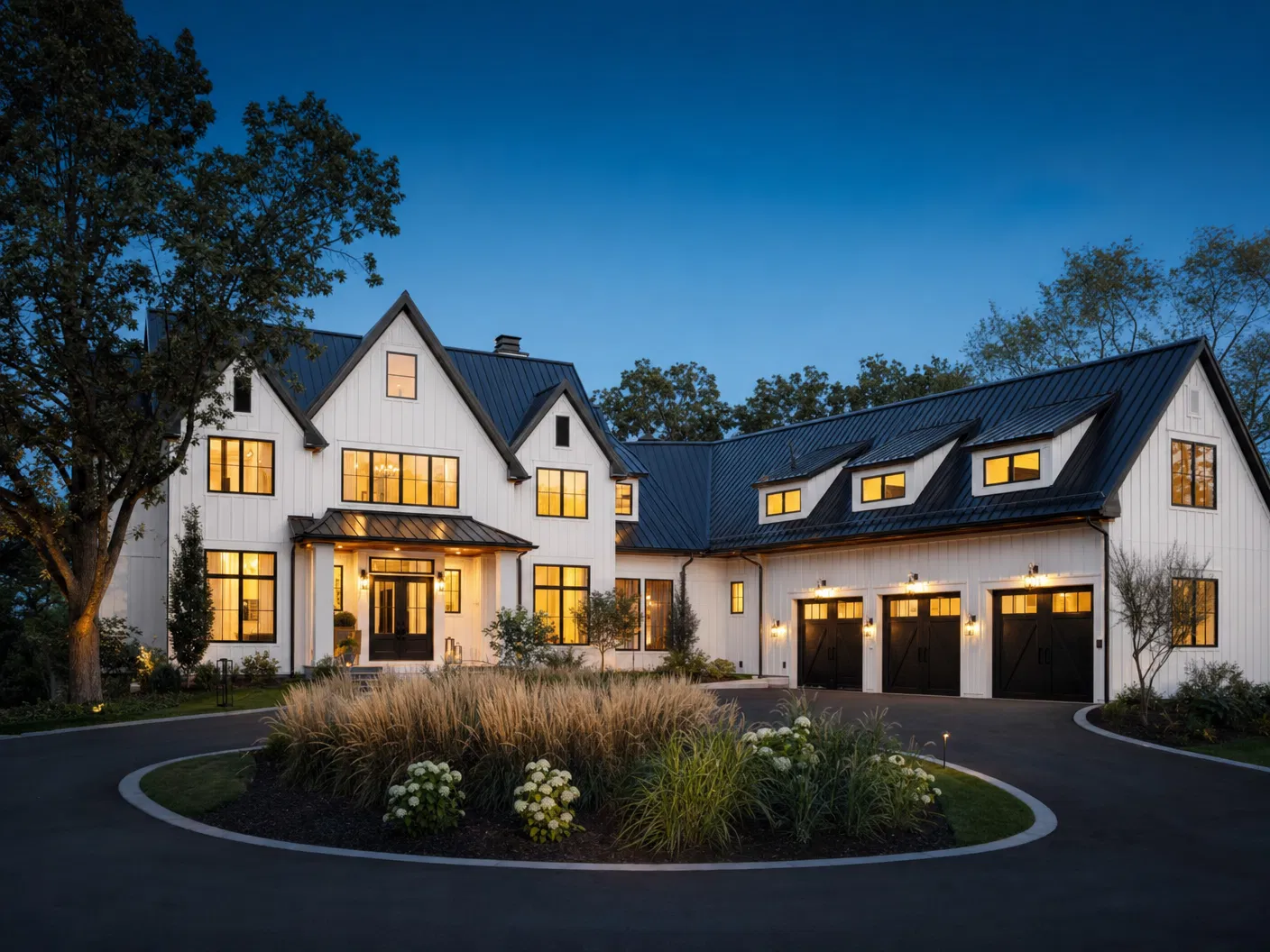 Newly constructed modern farmhouse custom home in Edina with three-car garage at twilight