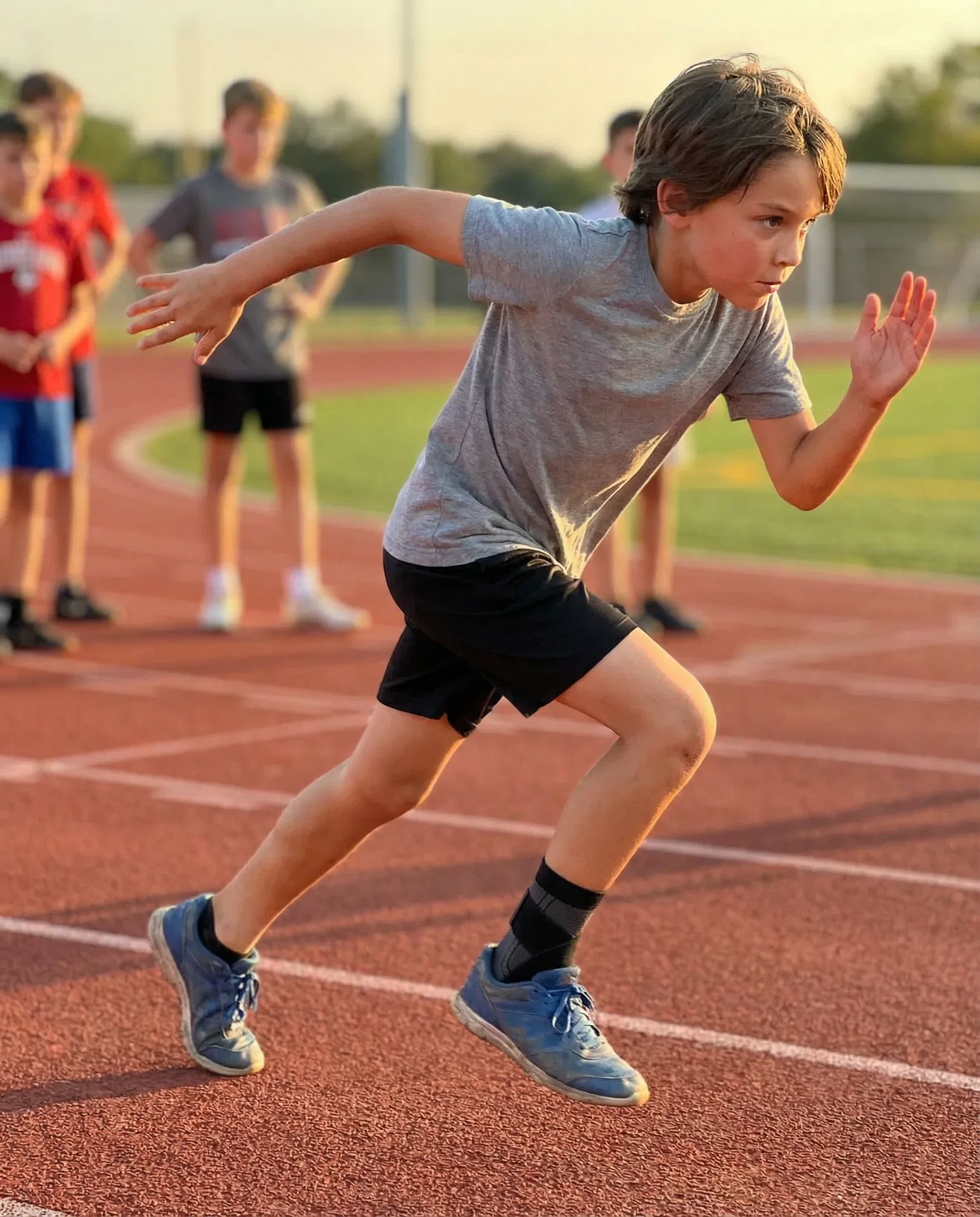 Young athlete sprinting on a track