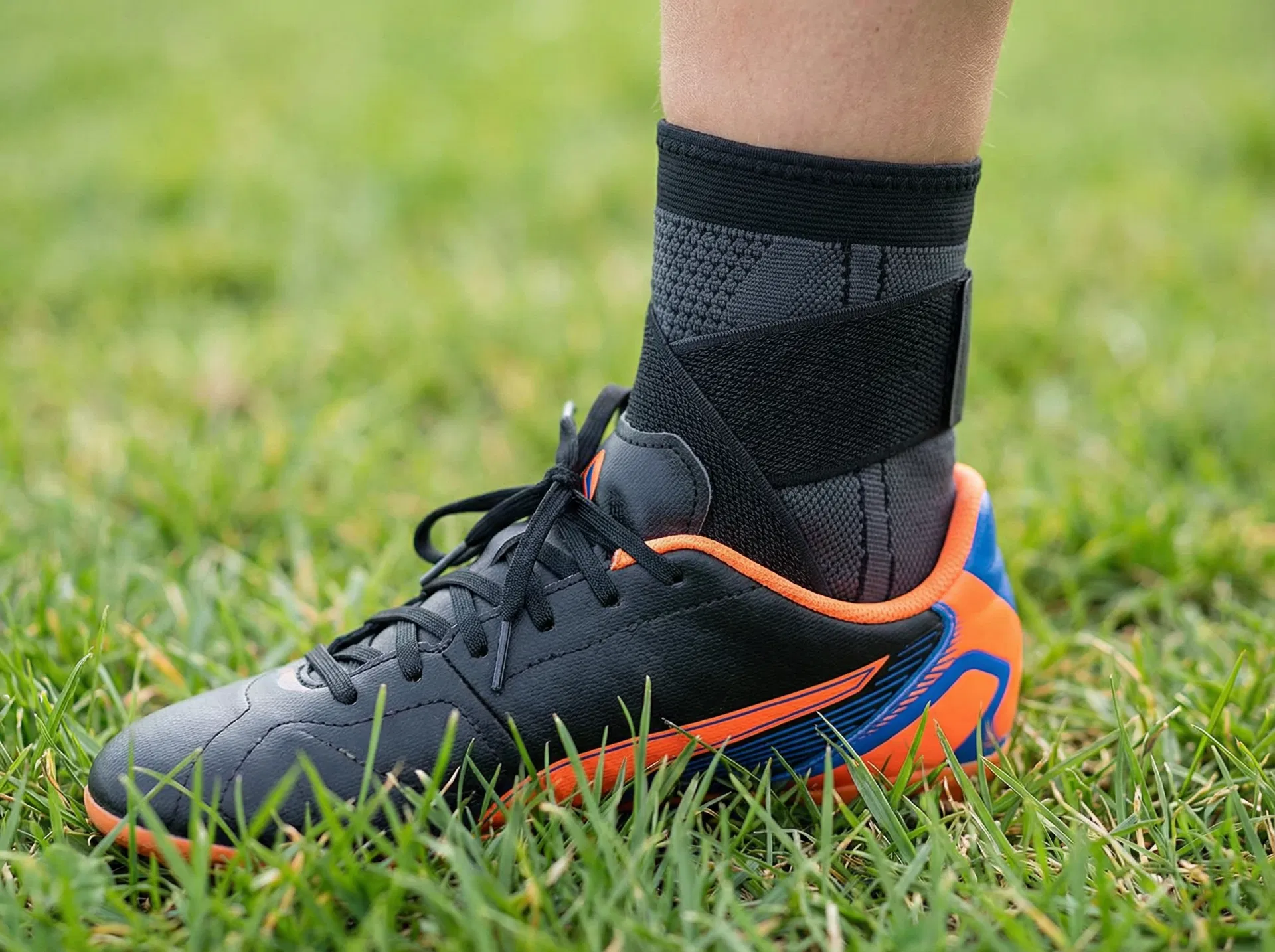 RecoverX sleeve fitting inside a soccer cleat — thin, low-profile, no bulk