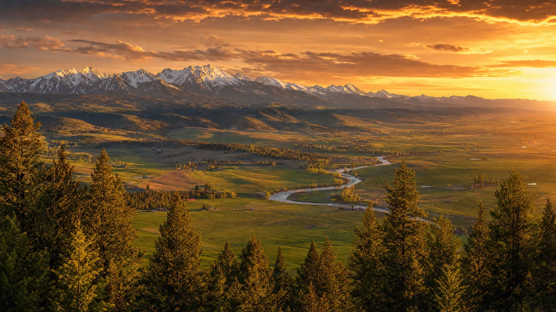 Licensed electrician working with Bitterroot Mountains at sunset