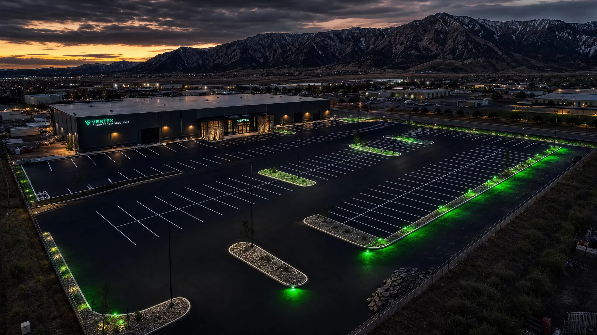 Aerial view of freshly paved and sealed parking lot at dusk