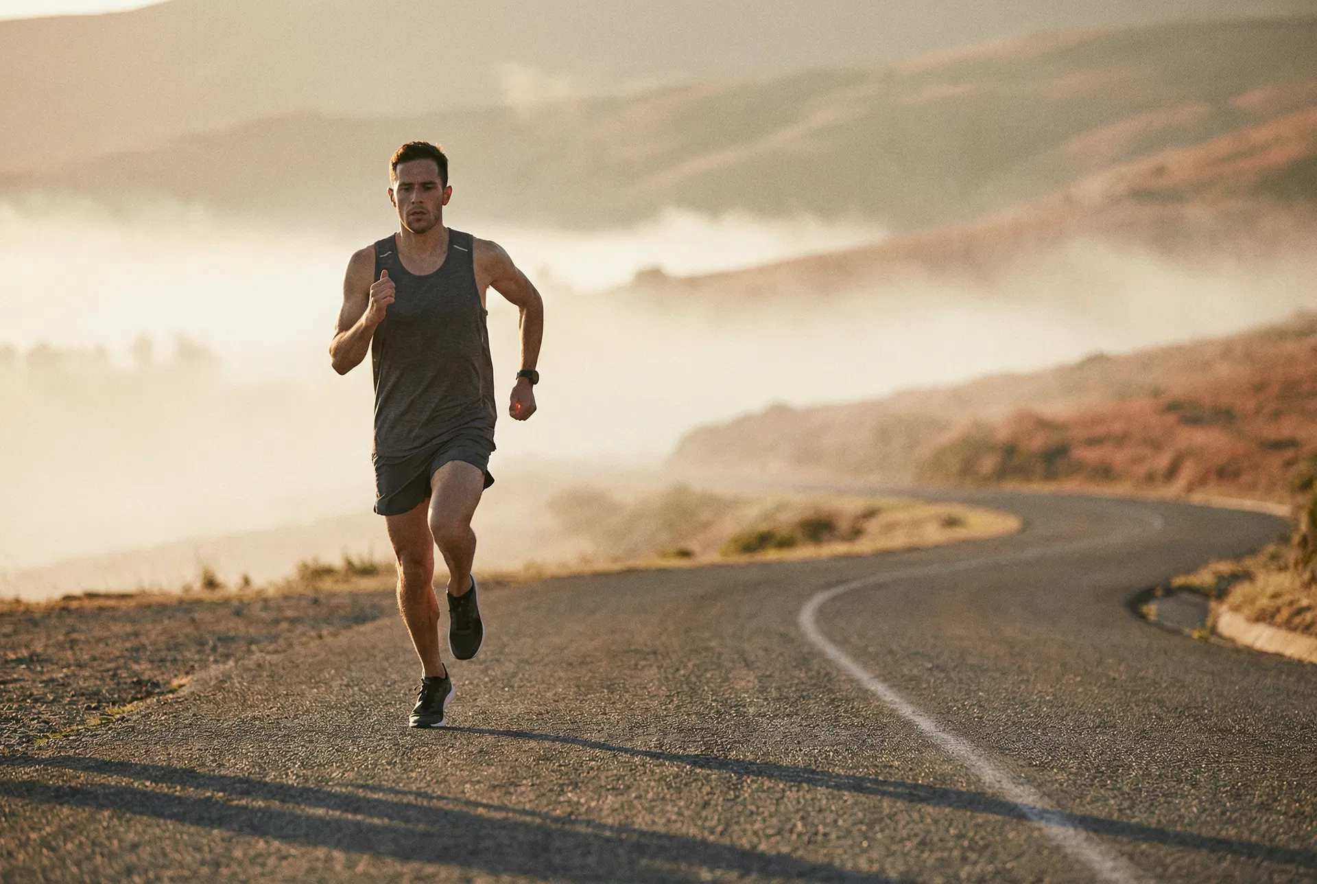Running on an open road at dawn