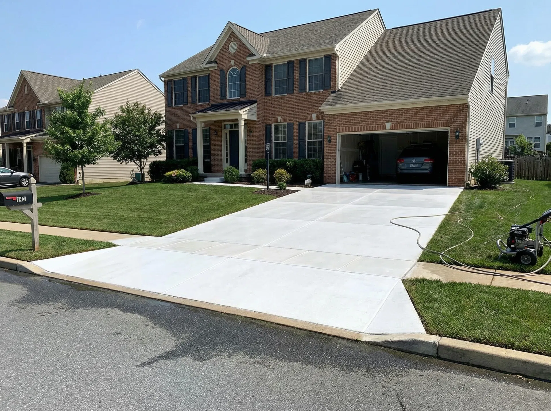 Clean pristine concrete driveway after professional power washing in Doylestown PA