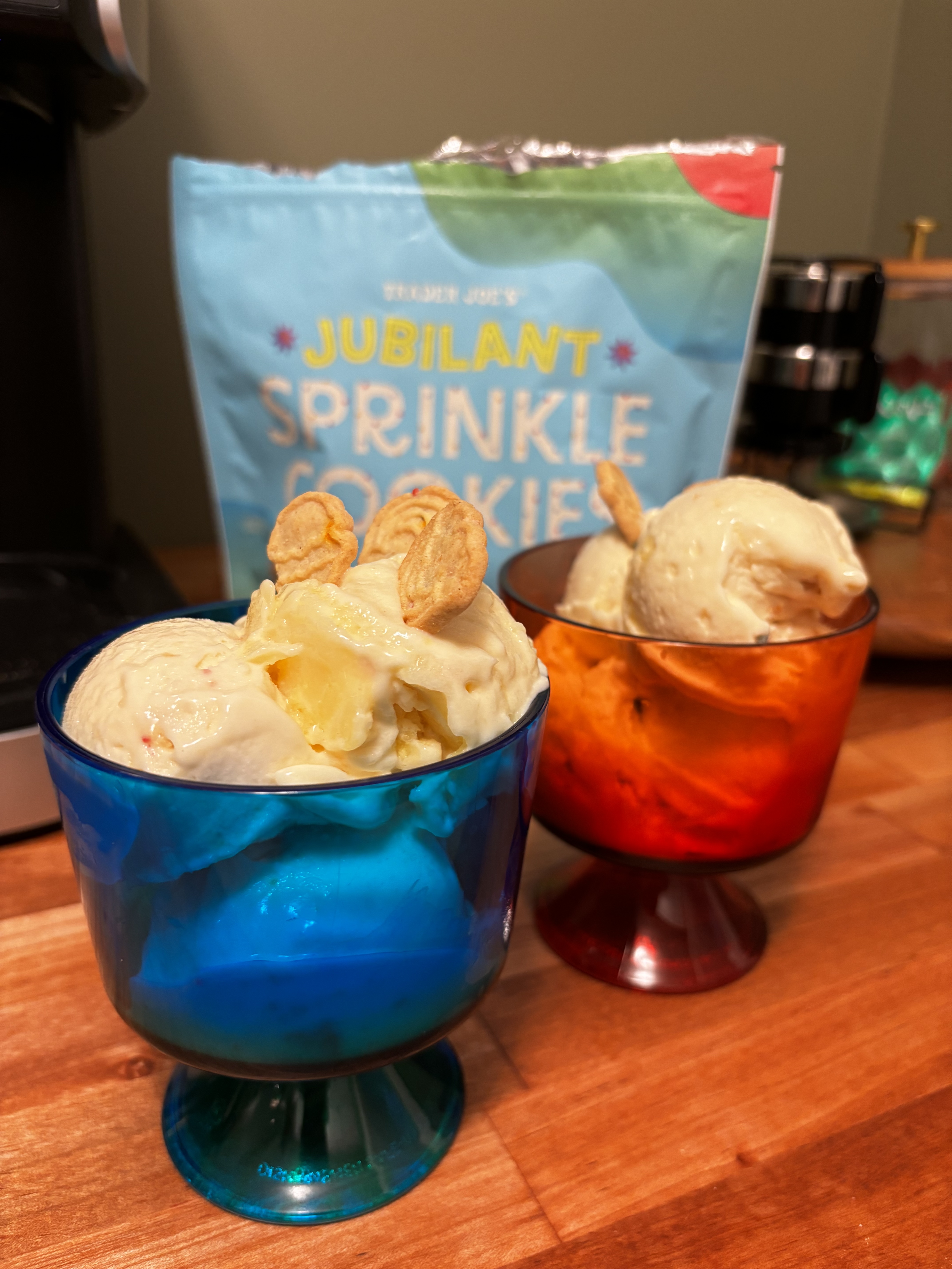 Vanilla Ninja Creami protein ice cream in blue and red bowls, topped with Trader Joe's Jubilant Sprinkle Cookies. 1