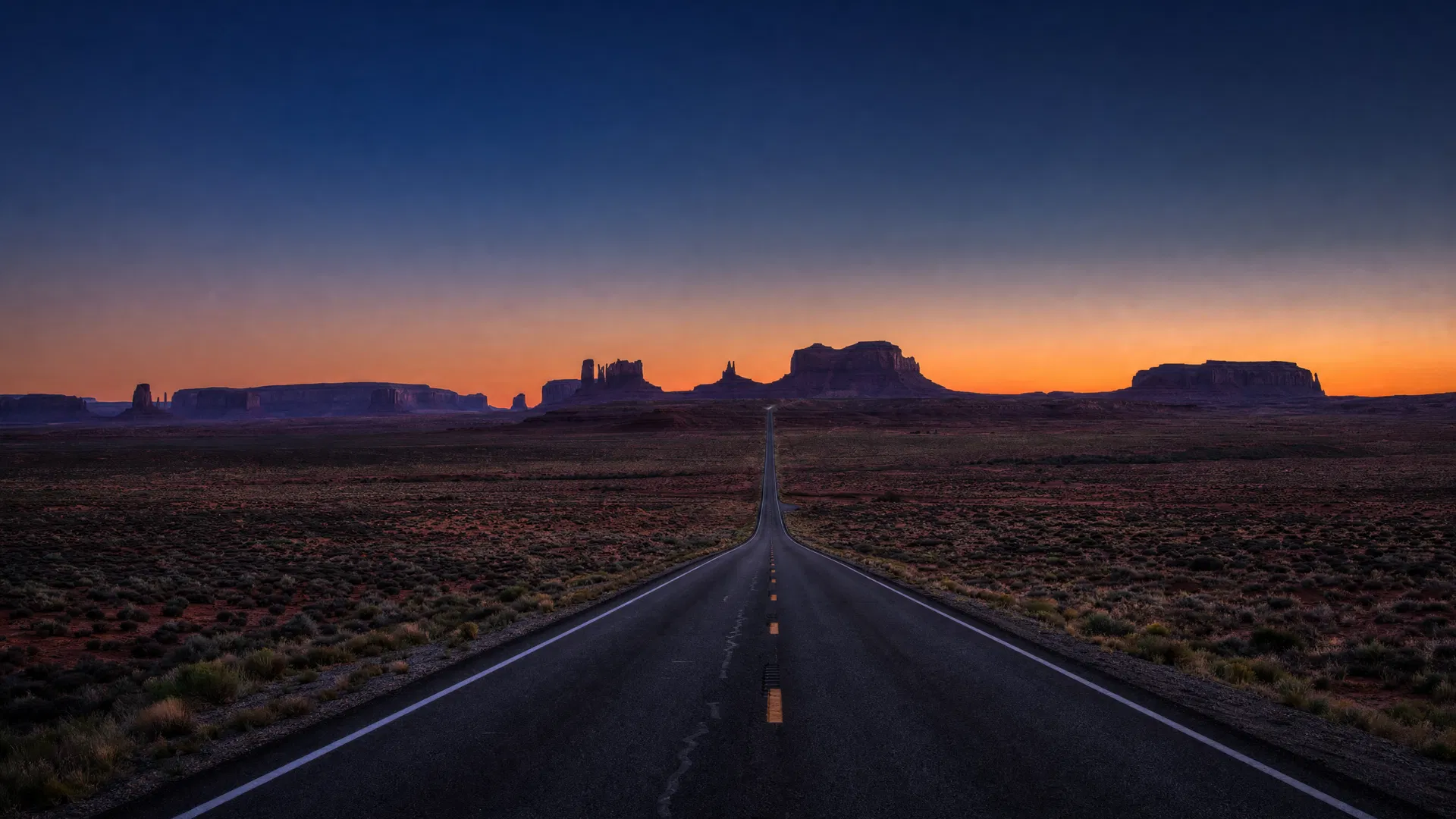 American landscape at twilight — empty terrain stretching toward the horizon