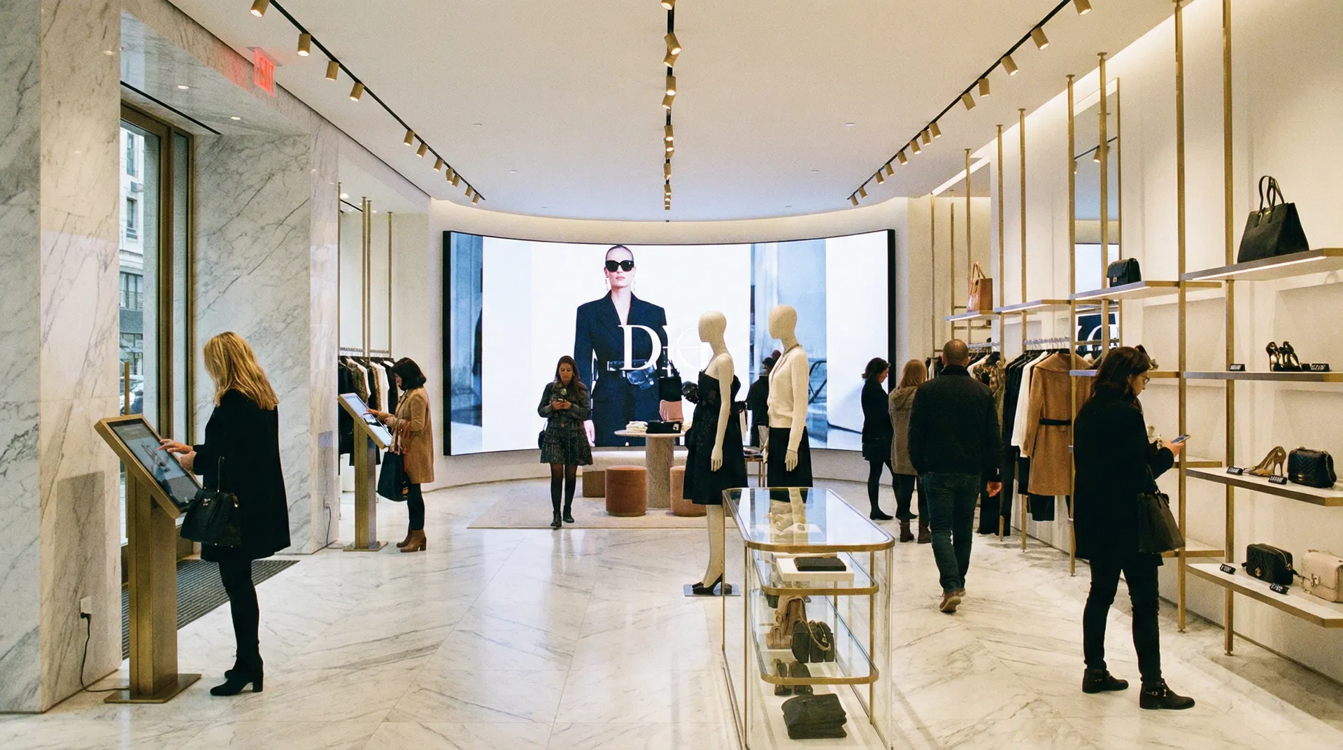 High-end retail store interior with video wall and interactive touch kiosks