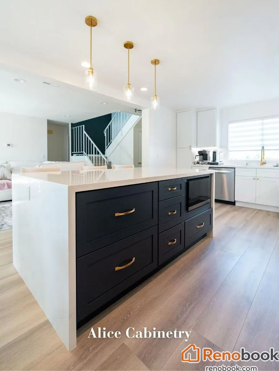 Modern kitchen with navy island, white quartz waterfall countertop, and gold accents in San Leandro, CA, USA