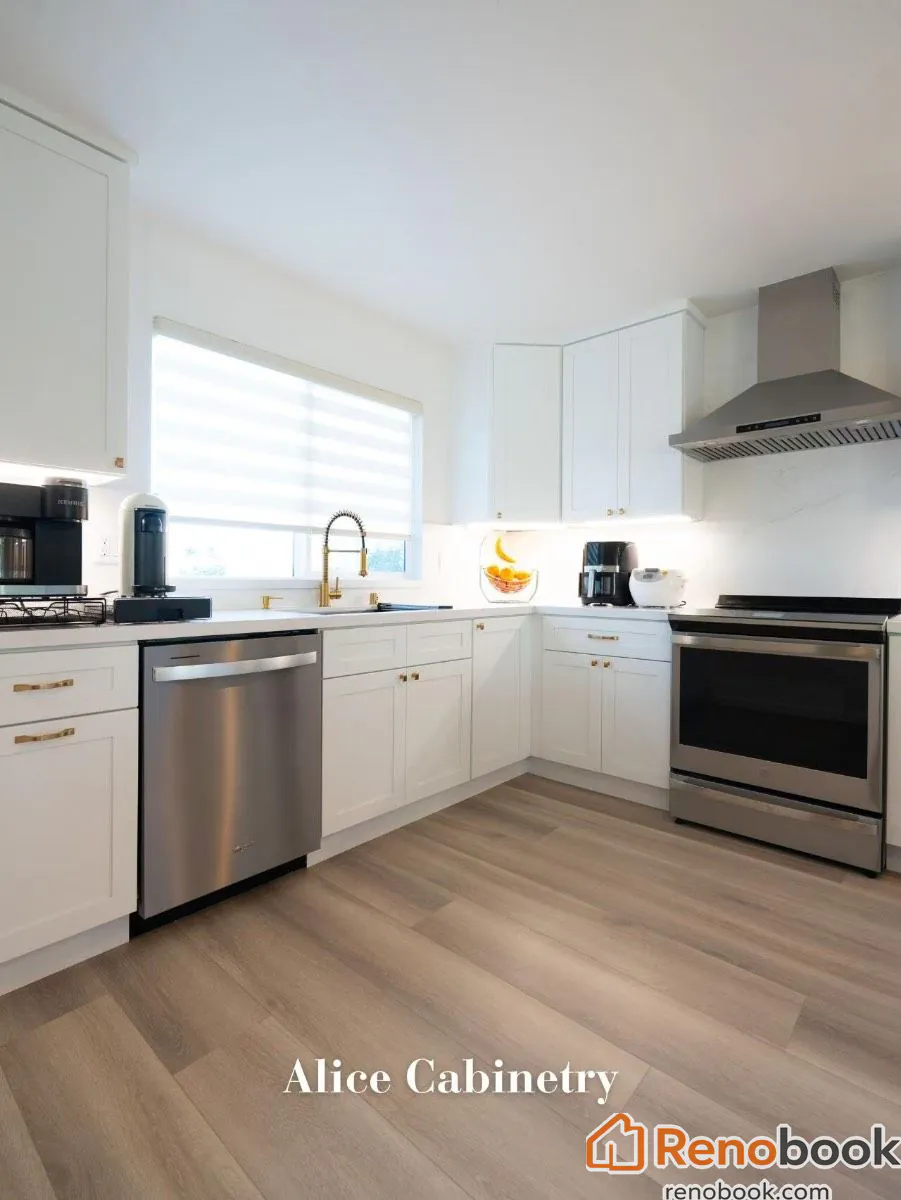 Modern kitchen with navy island, white quartz waterfall countertop, and gold accents in San Leandro, CA, USA