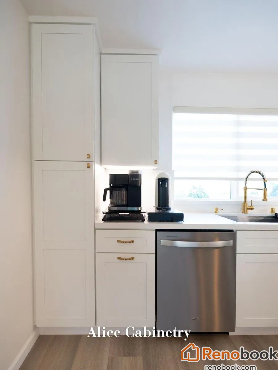 Modern kitchen with navy island, white quartz waterfall countertop, and gold accents in San Leandro, CA, USA