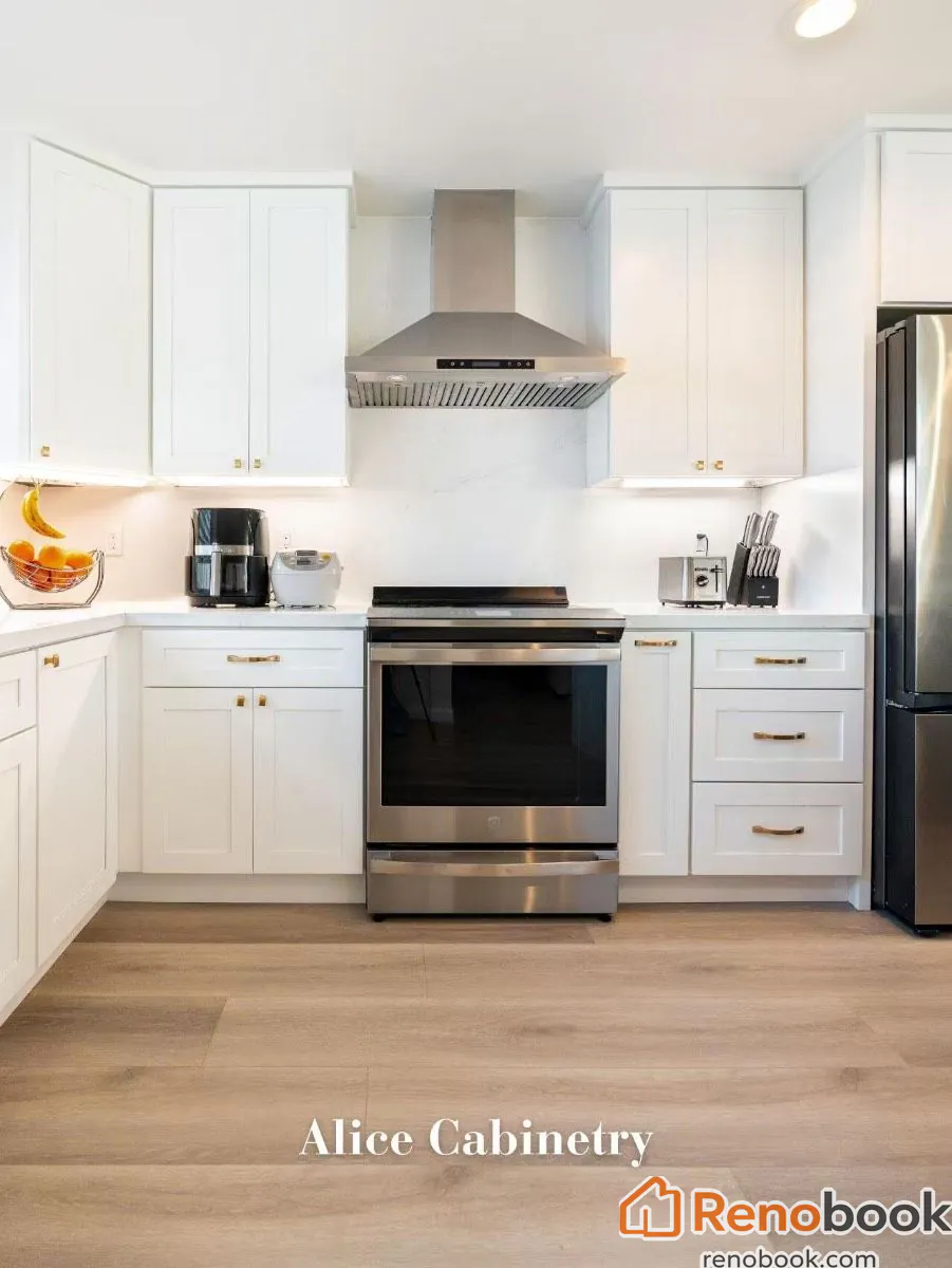 Modern kitchen with navy island, white quartz waterfall countertop, and gold accents in San Leandro, CA, USA