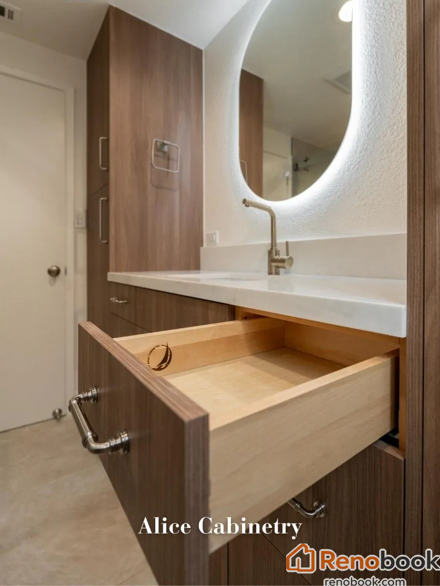 Modern walnut bathroom vanity with white quartz counter & brass faucet in San Leandro, CA, USA