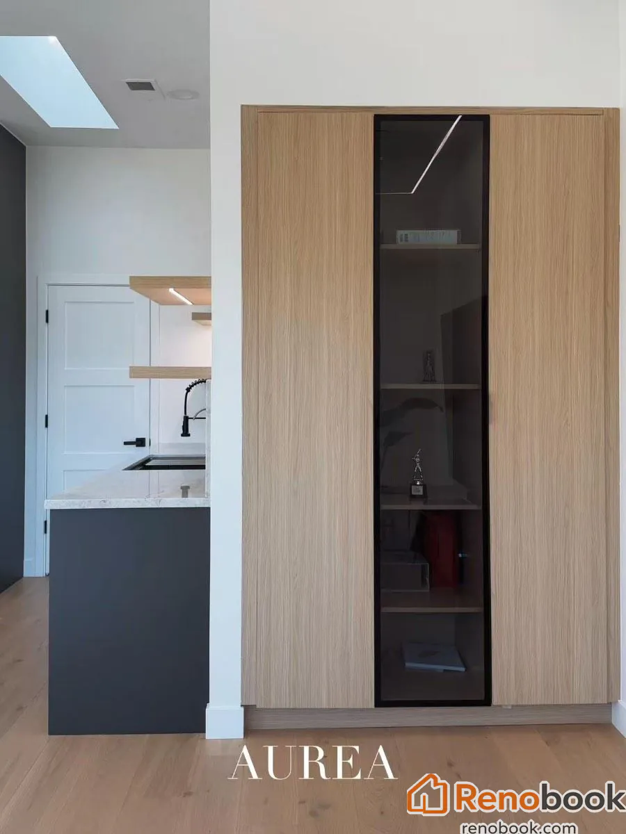 Modern two-tone kitchen with charcoal & oak cabinets, marble waterfall island in San Jose, CA, USA