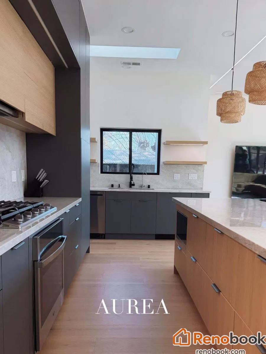 Modern two-tone kitchen with charcoal & oak cabinets, marble waterfall island in San Jose, CA, USA