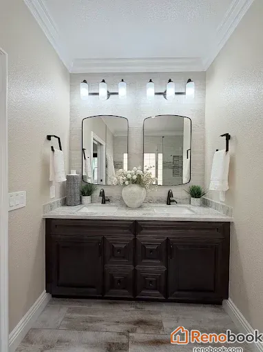 Modern double vanity bathroom with dark wood cabinetry & black fixtures in Las Vegas, NV, USA