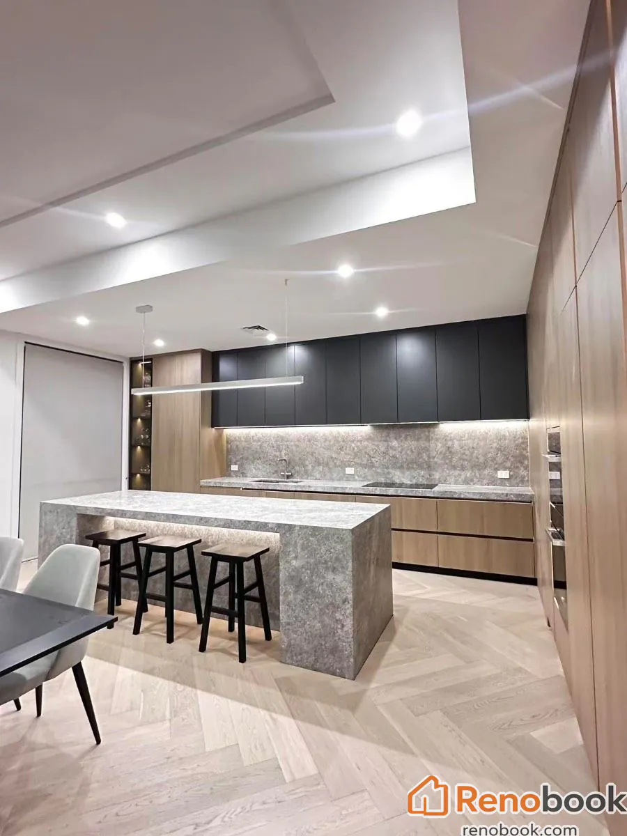 Modern kitchen with waterfall island & herringbone wood flooring in Melbourne VIC, Australia