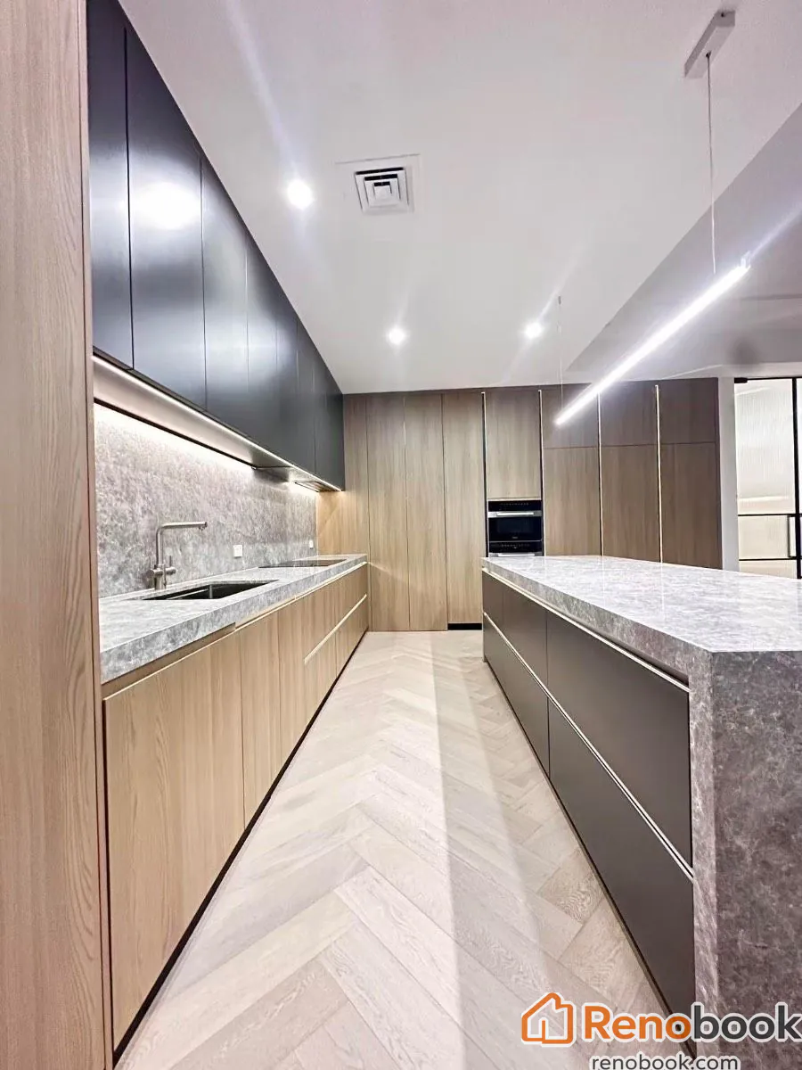 Modern kitchen with waterfall island & herringbone wood flooring in Melbourne VIC, Australia