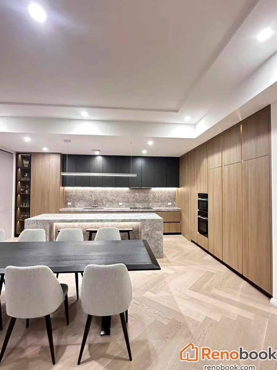 Modern kitchen with waterfall island & herringbone wood flooring in Melbourne VIC, Australia