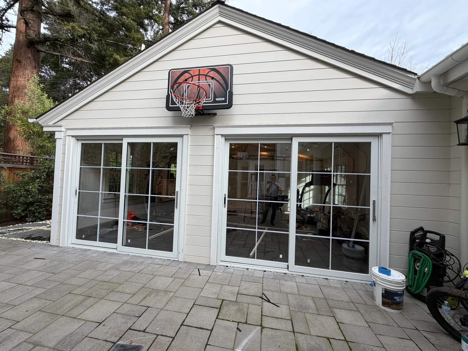 Replace a garage door with a glass door