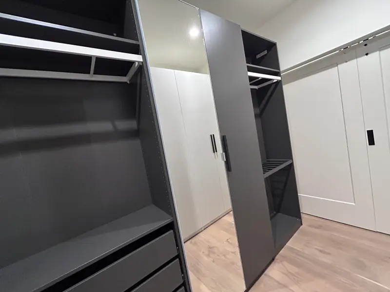 Use IKEA cabinets to create a walk in closet 