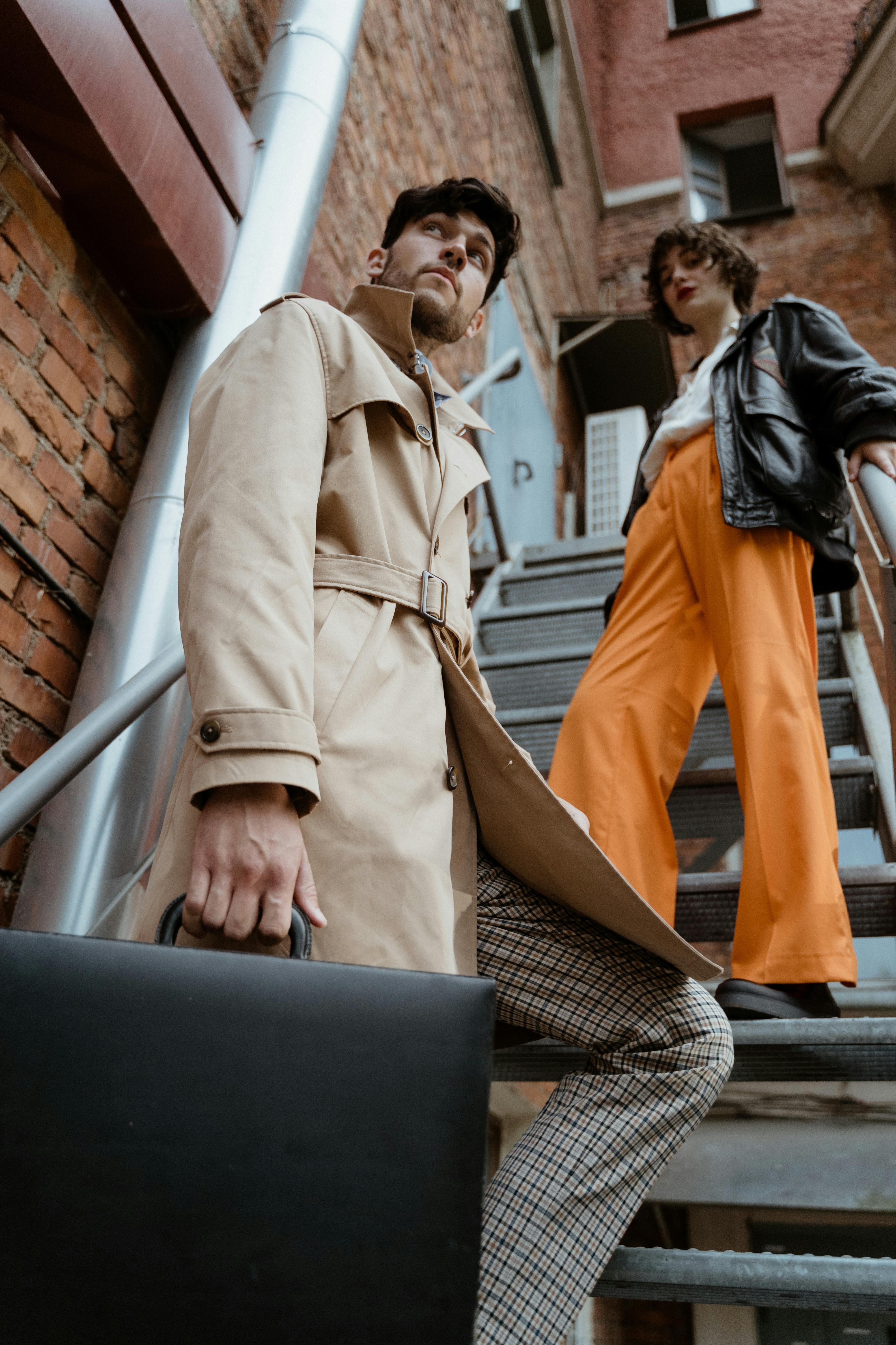 Stylish Couple on Urban Staircase with Briefcase