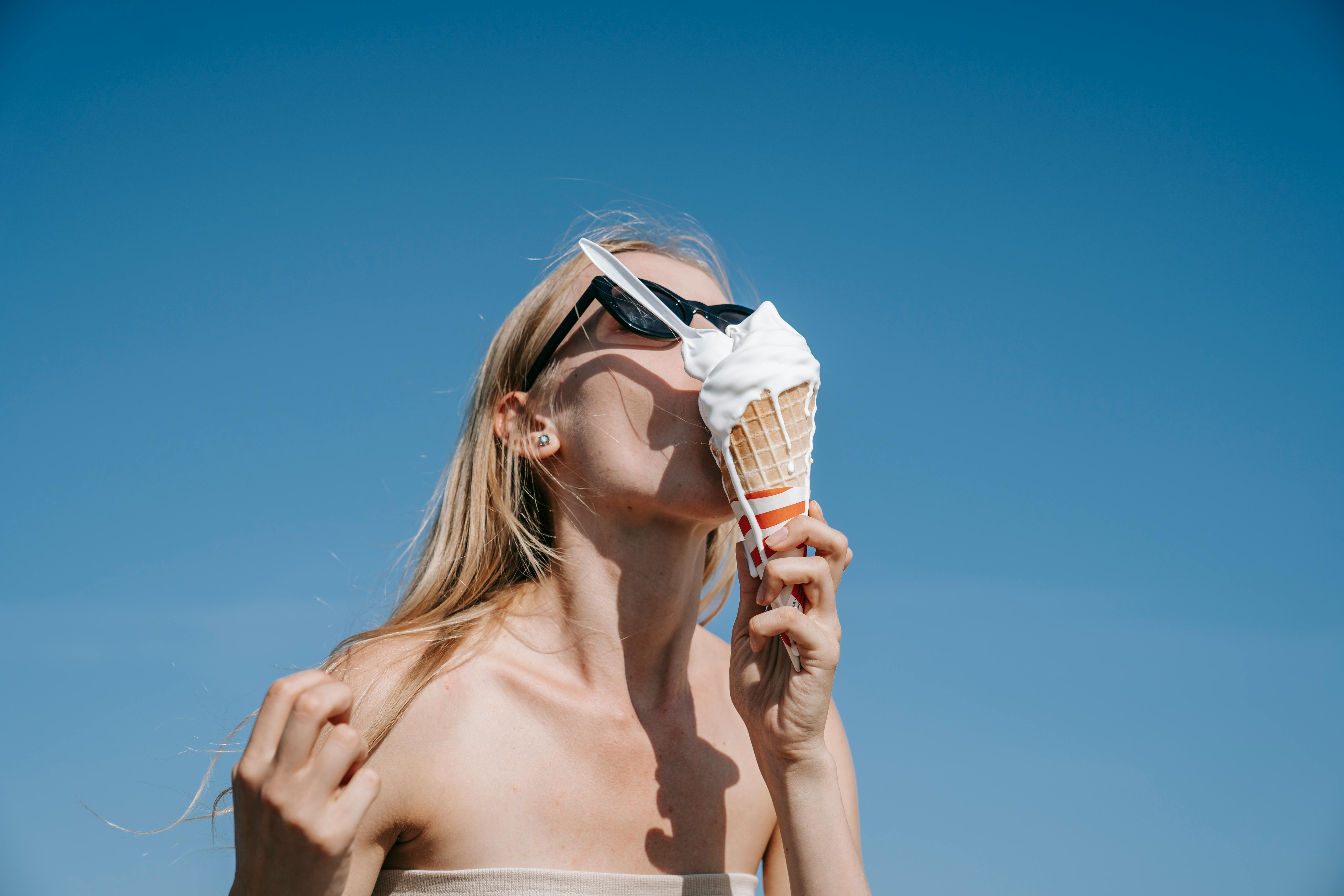 Blonde Woman with Melting Ice Cream on Face