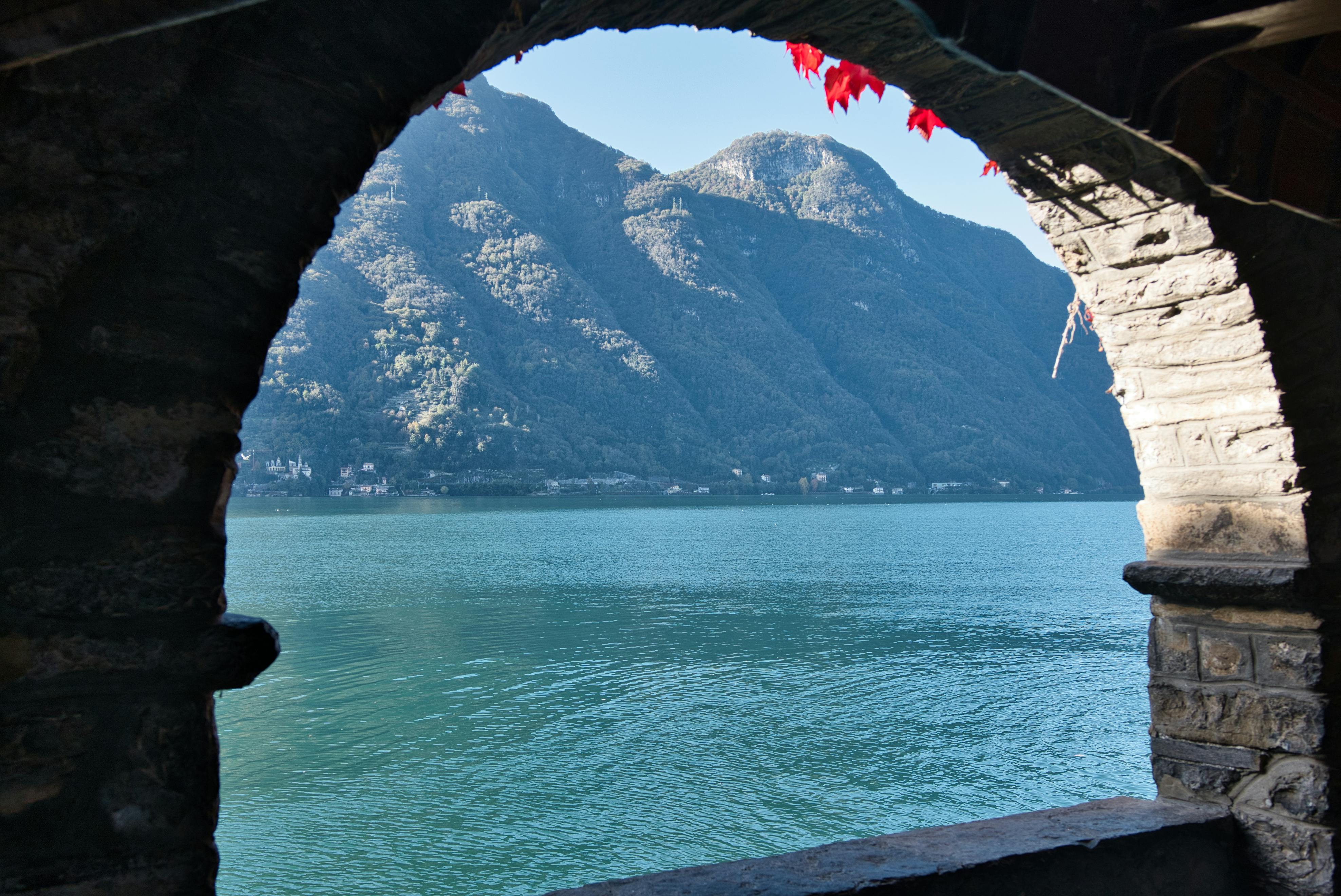 Lake and Mountains Through Stone Archway