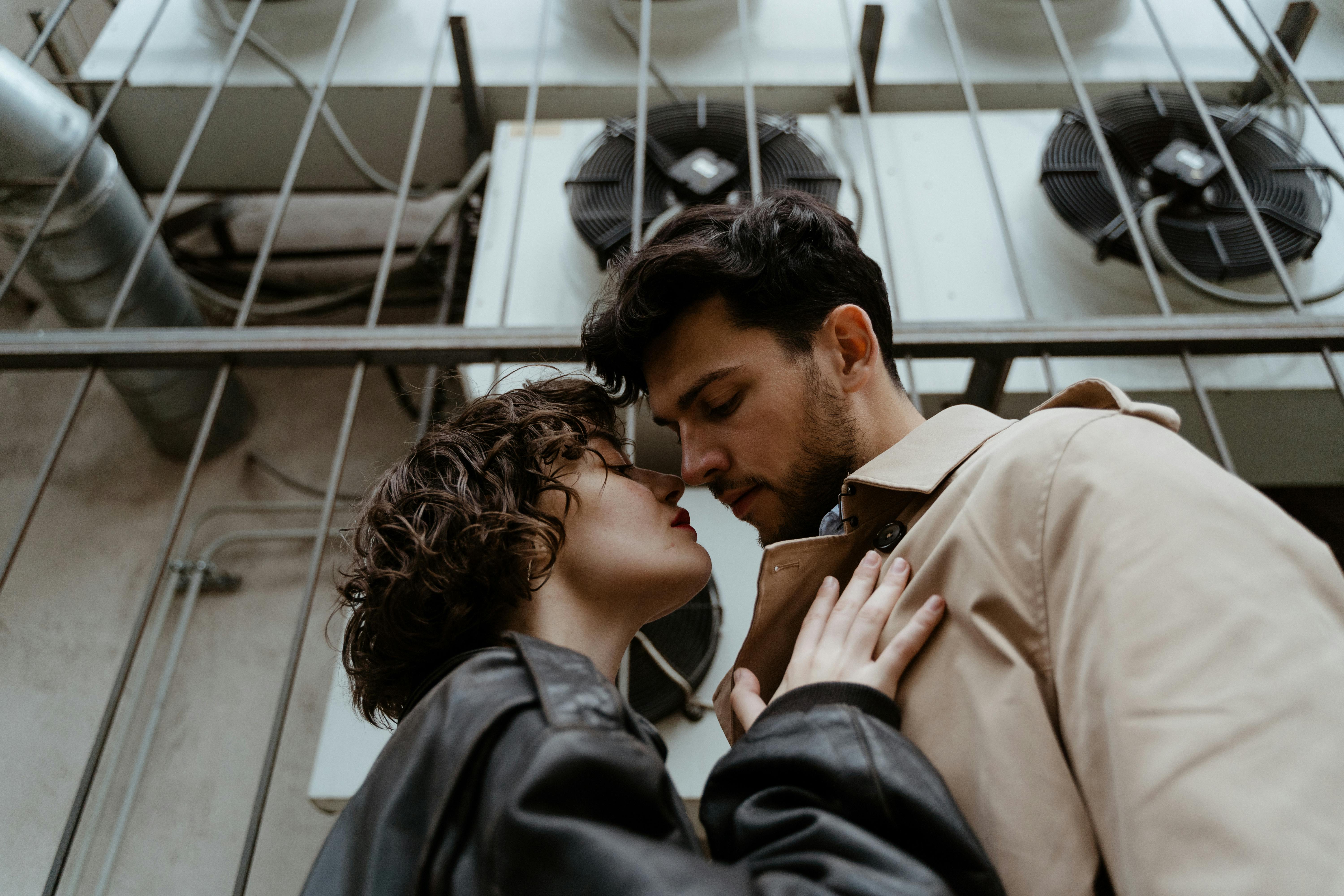 Young Couple Sharing an Intimate Moment Outdoors
