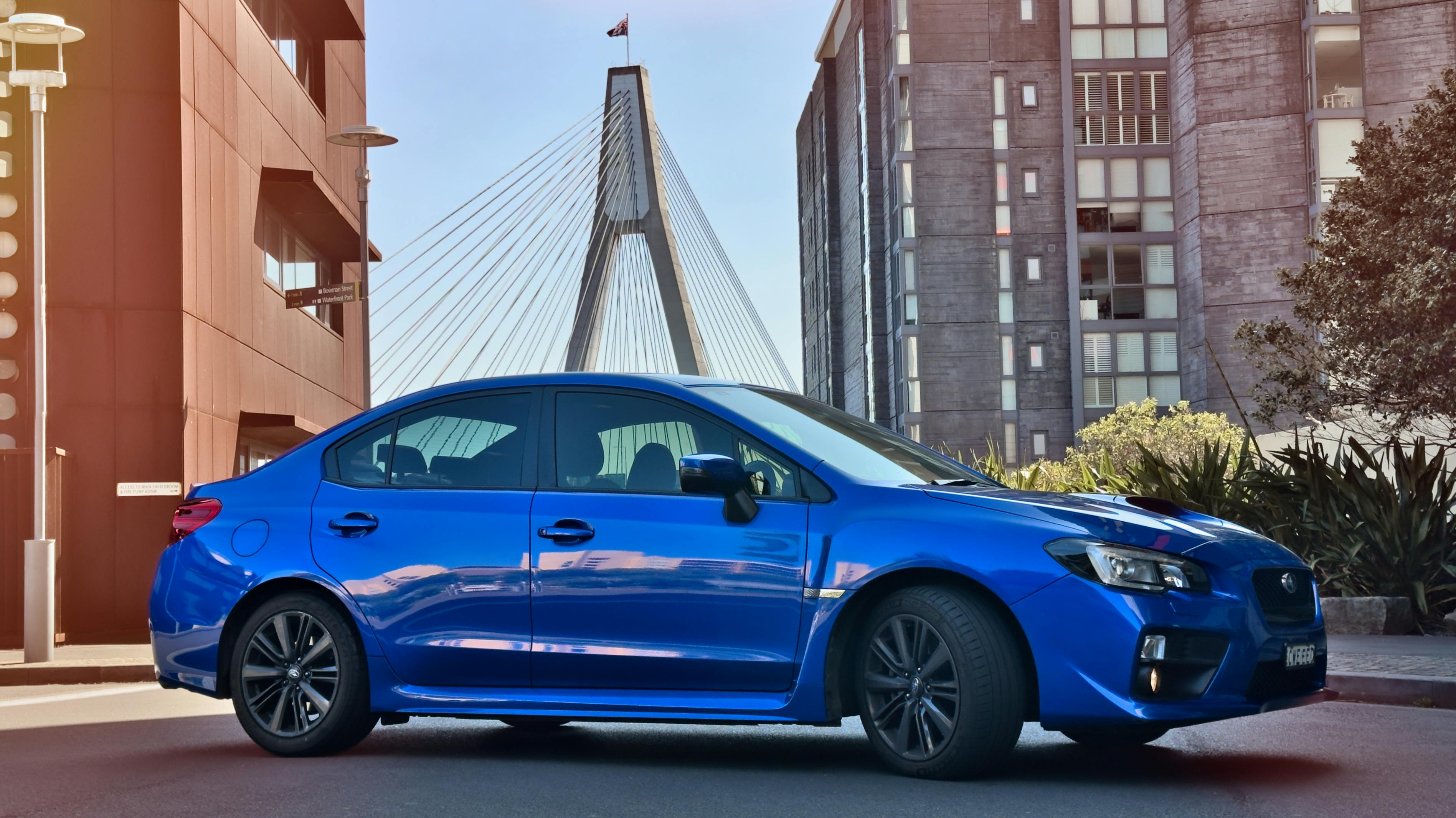 Blue Subaru WRX Parked in Urban Cityscape
