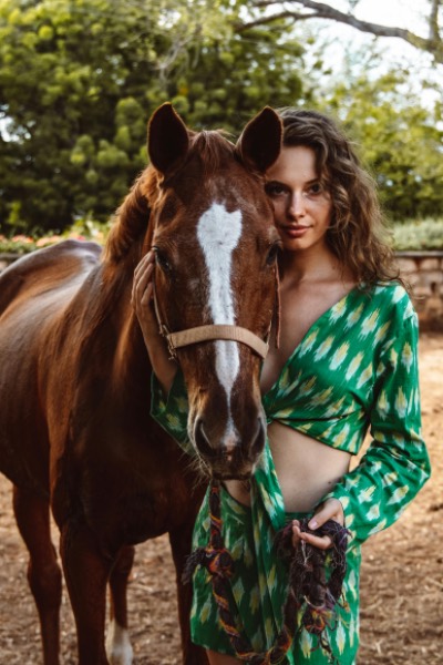 Young Woman and Horse Share Gentle Moment