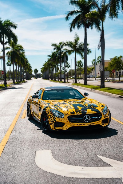 Yellow Mercedes-Benz Sports Car on Palm-Lined Street
