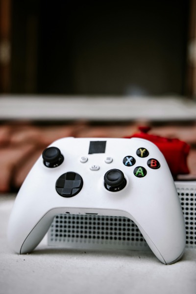 White Xbox Wireless Controller on Console Surface