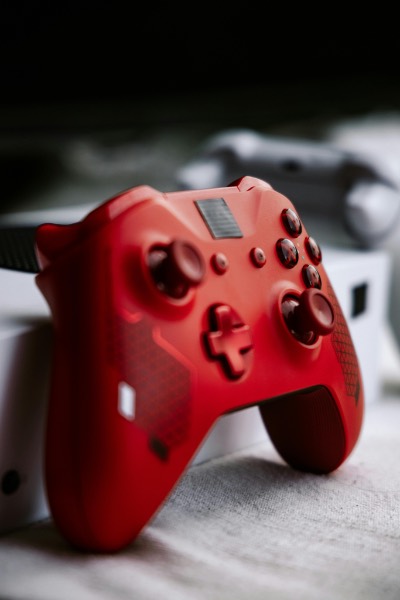 Vibrant Red Gaming Controller on White Surface