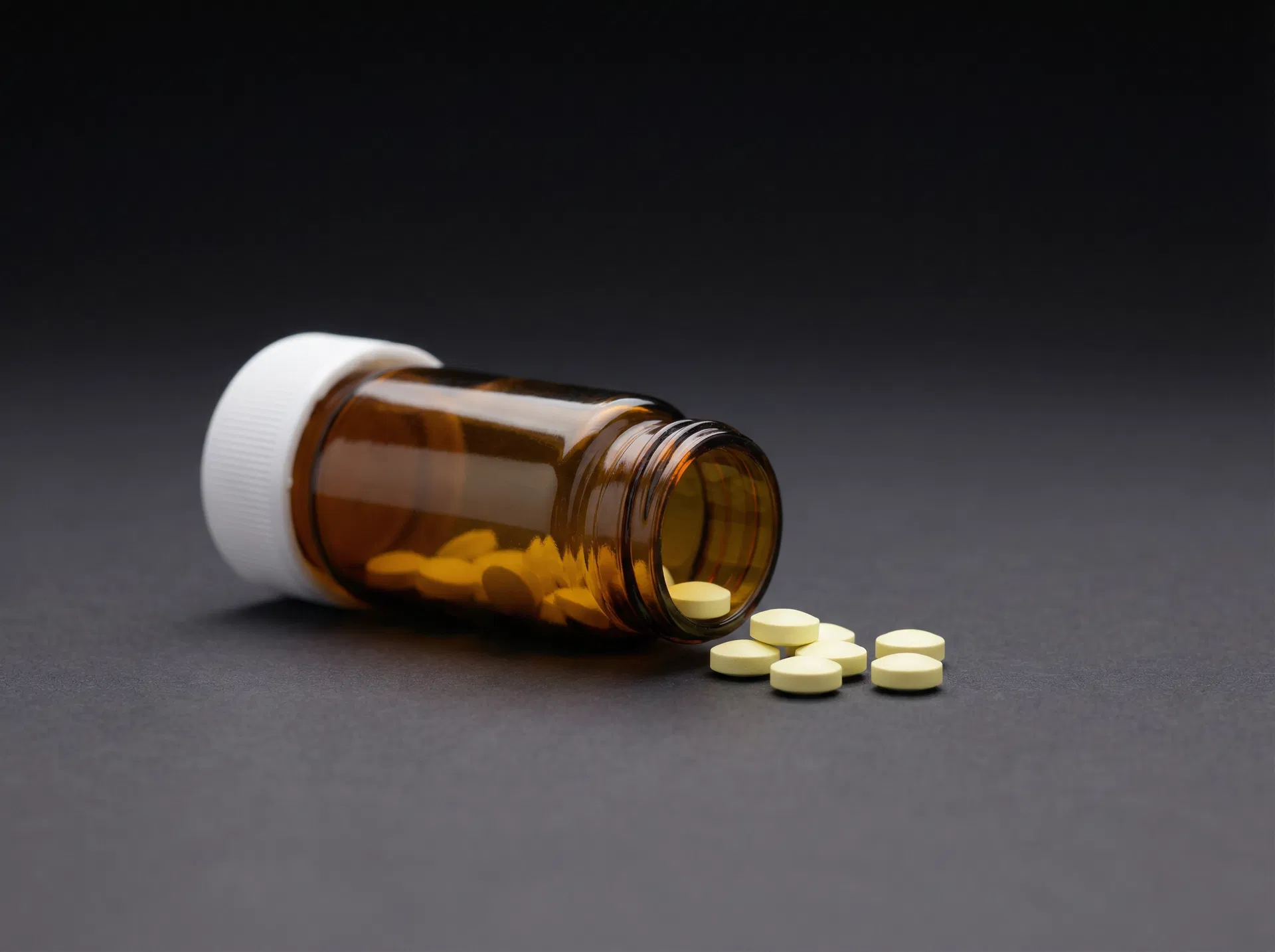 Tadalafil prescription tablets — amber bottle with pale yellow pills